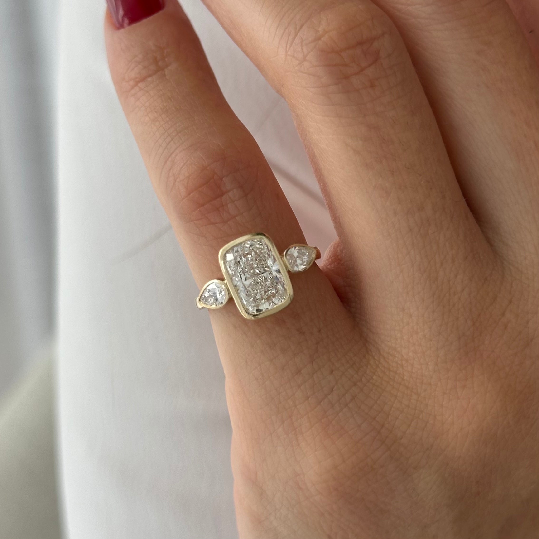 2 carat Elongated Cushion cut lab-grown diamond IGI certified, bezel engagement ring.