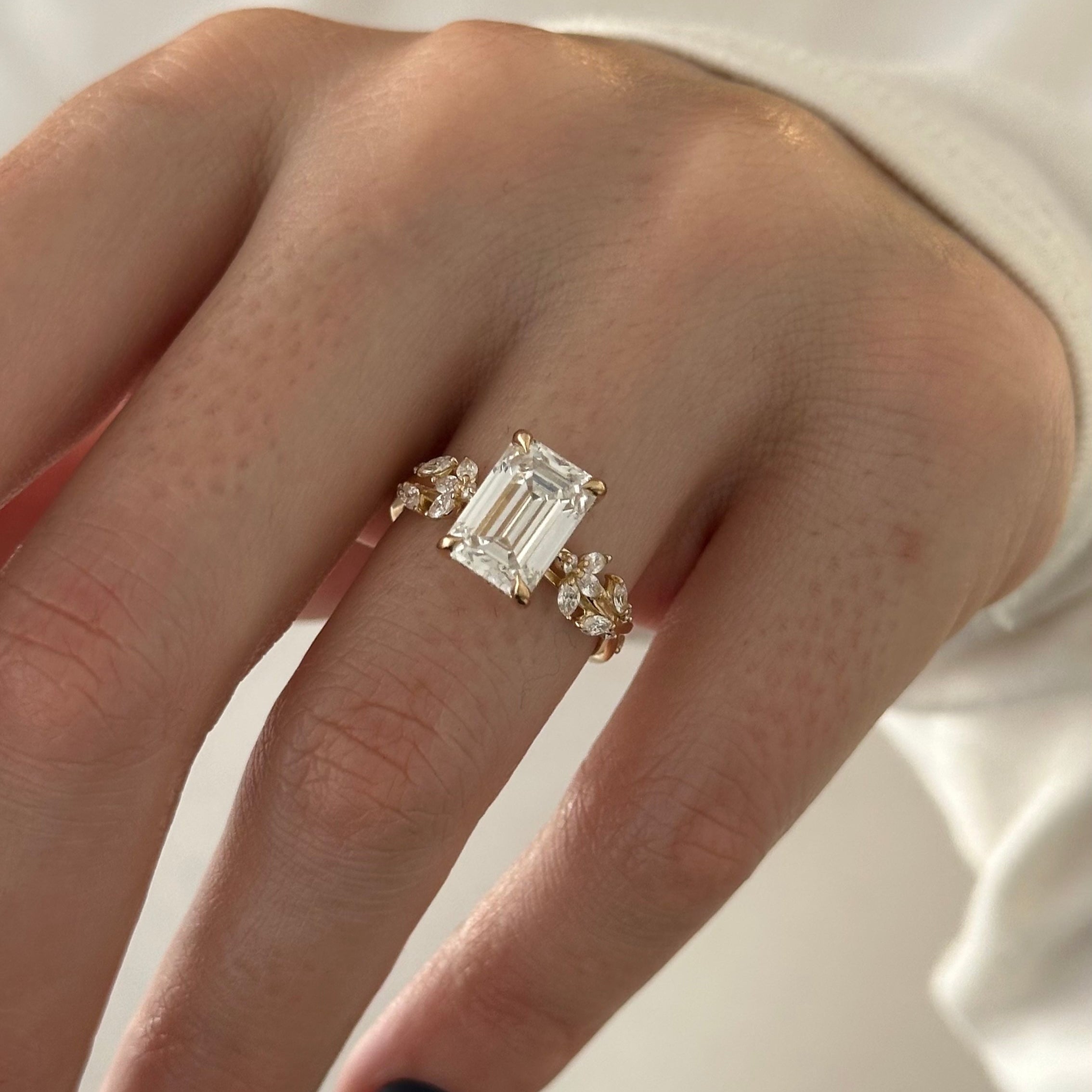 all-groups | 3 carat Emerald cut lab-grown diamond IGI certified, side stones engagement ring.