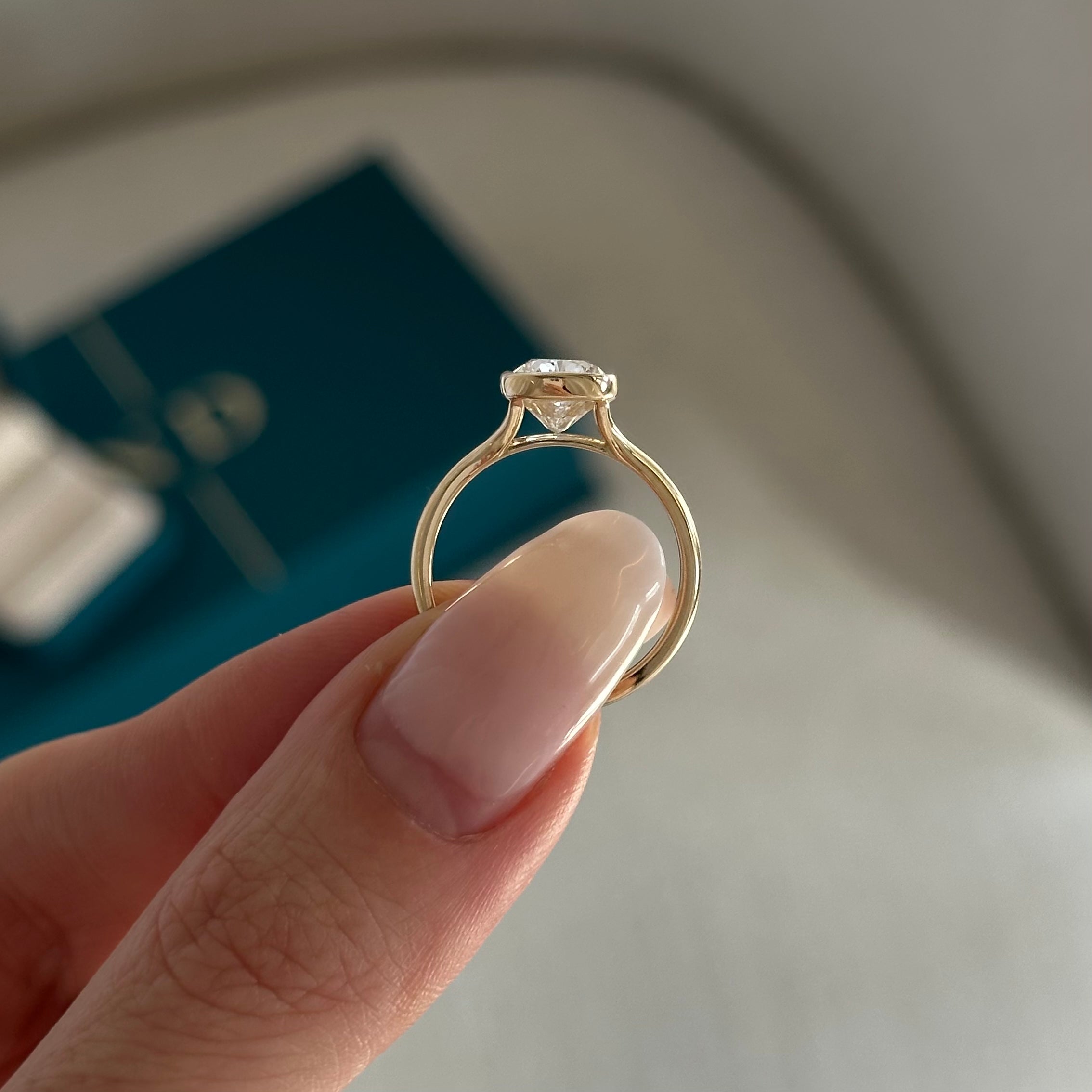 2 carat Elongated Cushion cut lab-grown diamond IGI certified, bezel engagement ring.