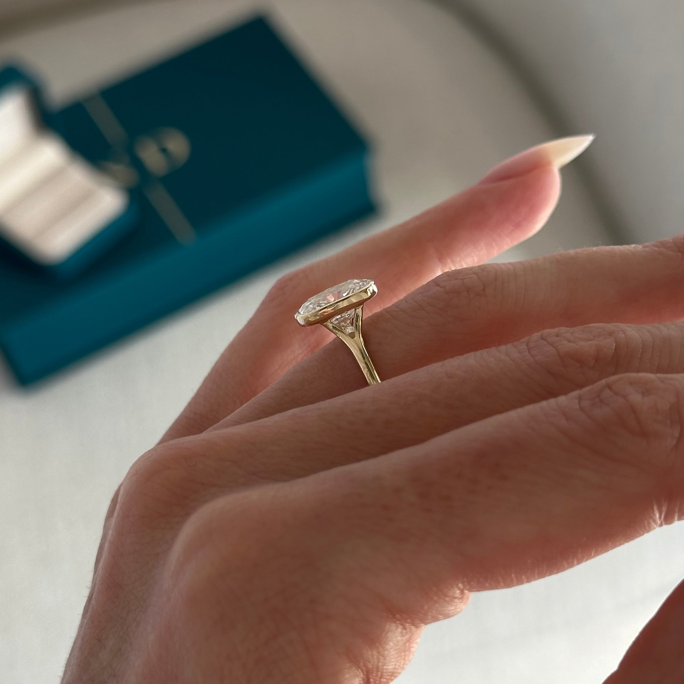 2 carat Elongated Cushion cut lab-grown diamond IGI certified, bezel engagement ring.