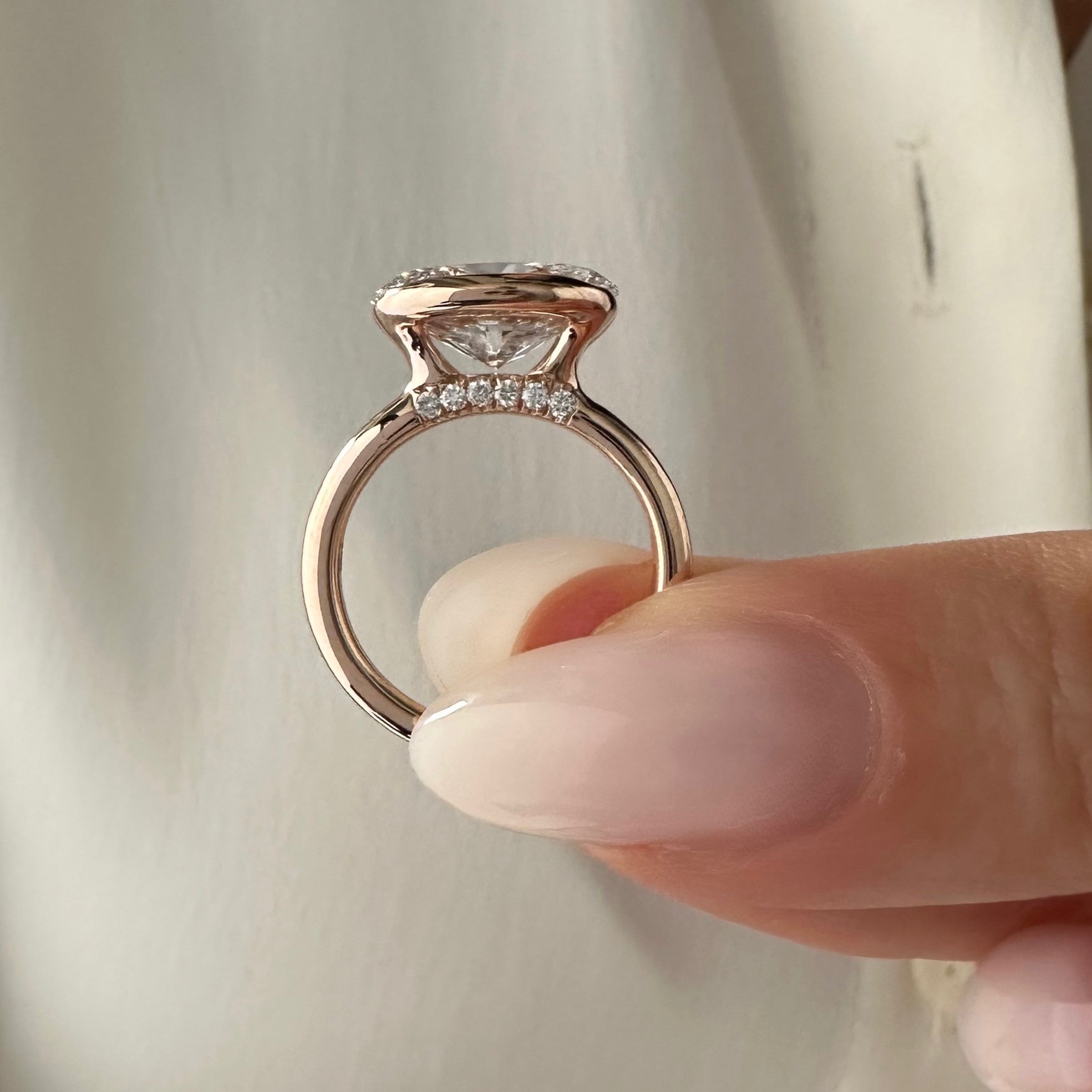 3 carat Oval cut lab-grown diamond IGI certified, bezel engagement ring.