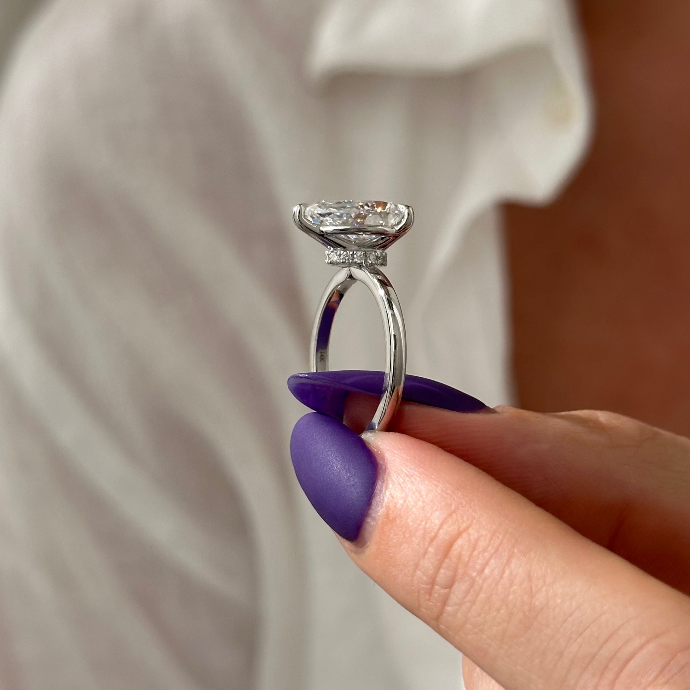 3 carat Pear cut lab-grown diamond IGI certified, hidden halo engagement ring.