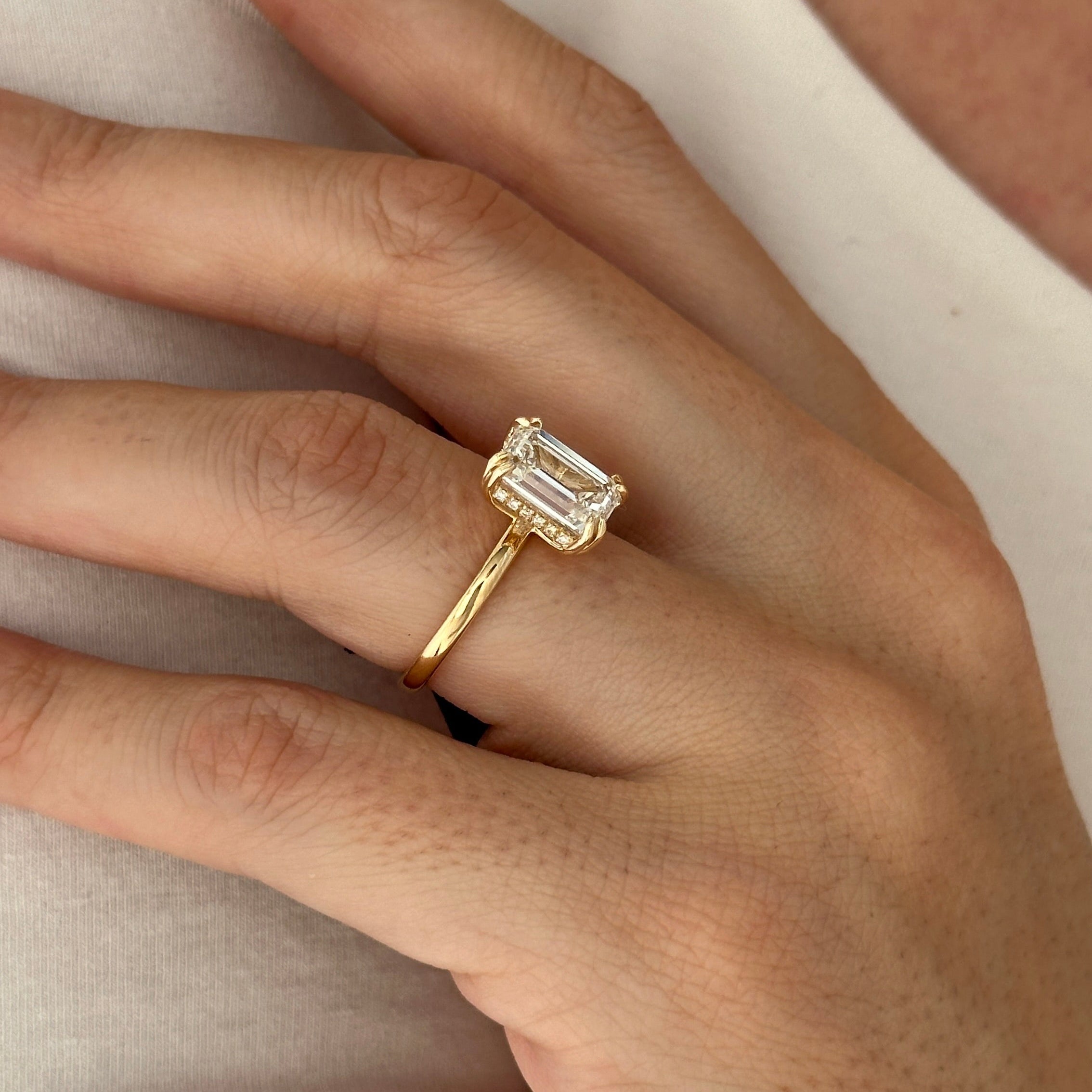 3 carat Emerald cut lab-grown diamond IGI certified, hidden halo engagement ring.