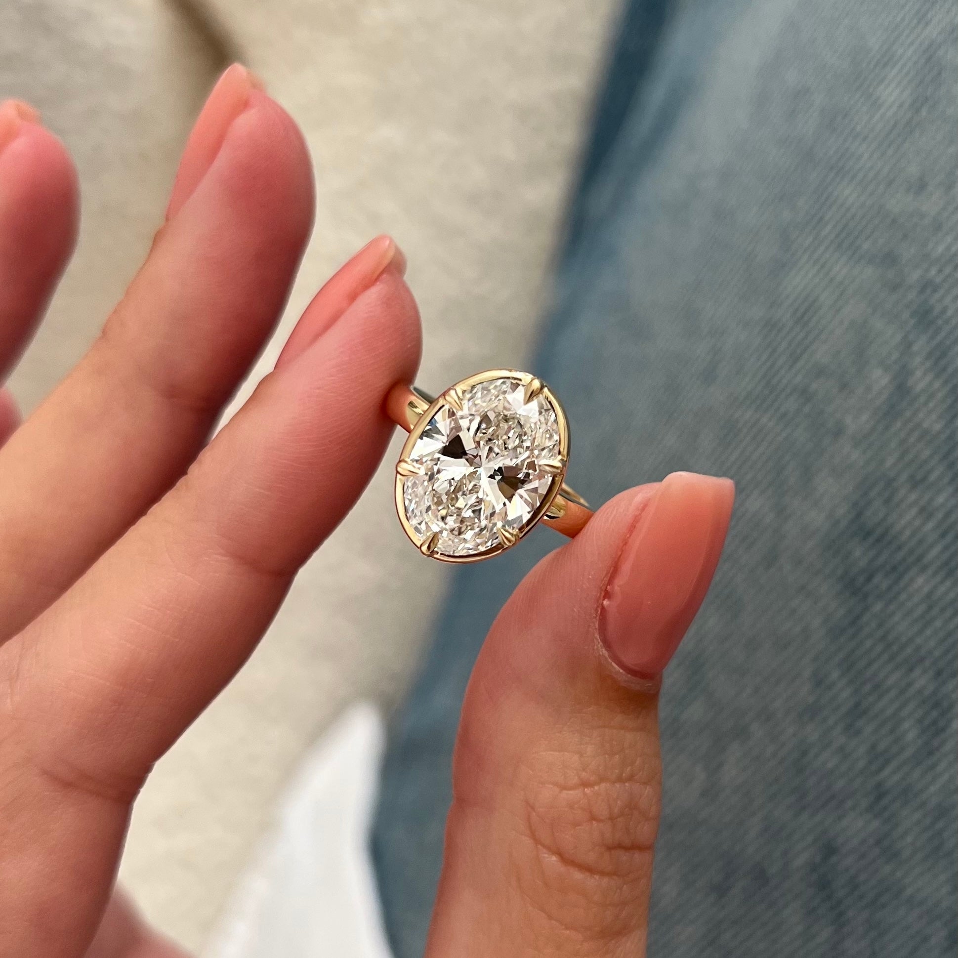 5 carat Oval cut lab-grown diamond IGI certified, bezel engagement ring.