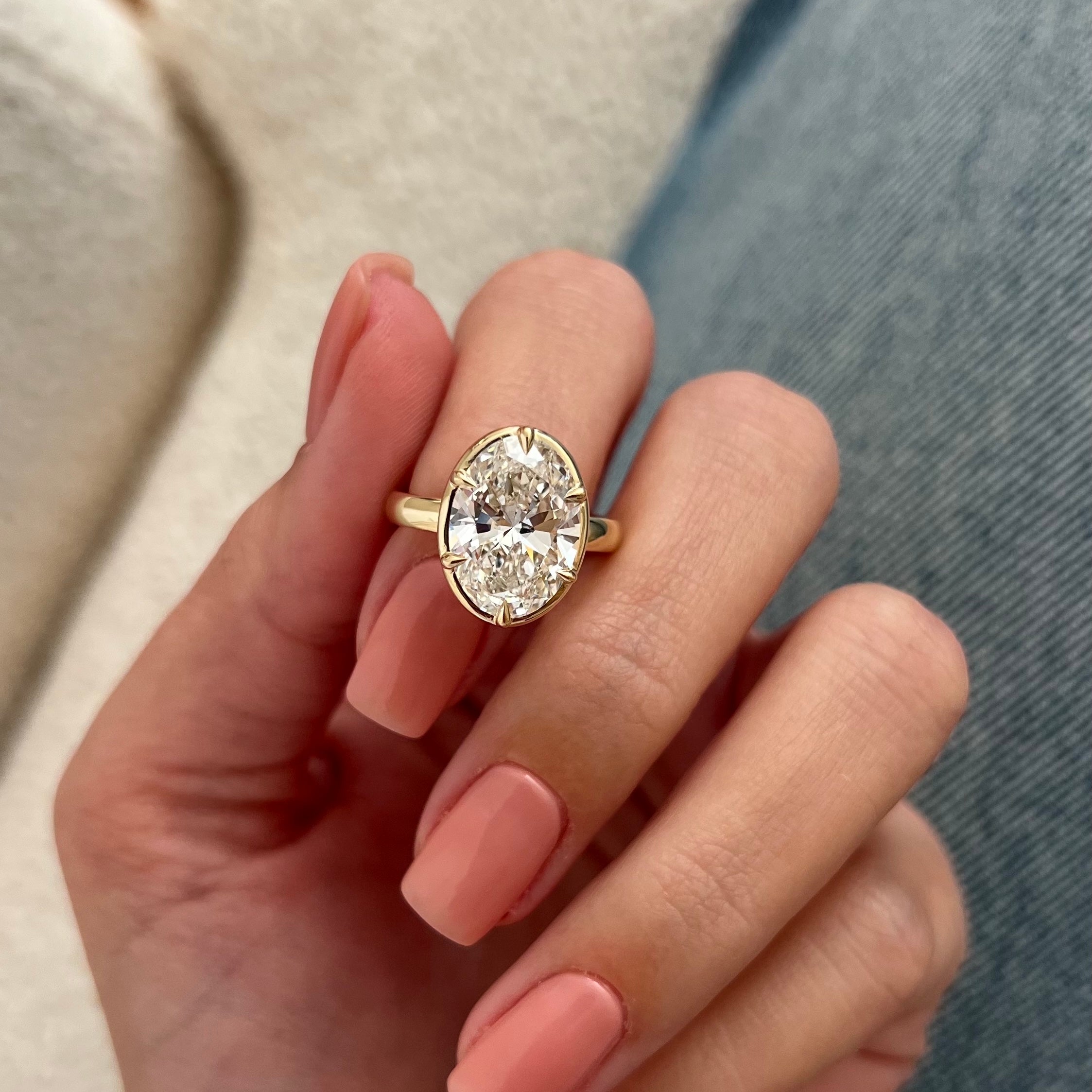 5 carat Oval cut lab-grown diamond IGI certified, bezel engagement ring.