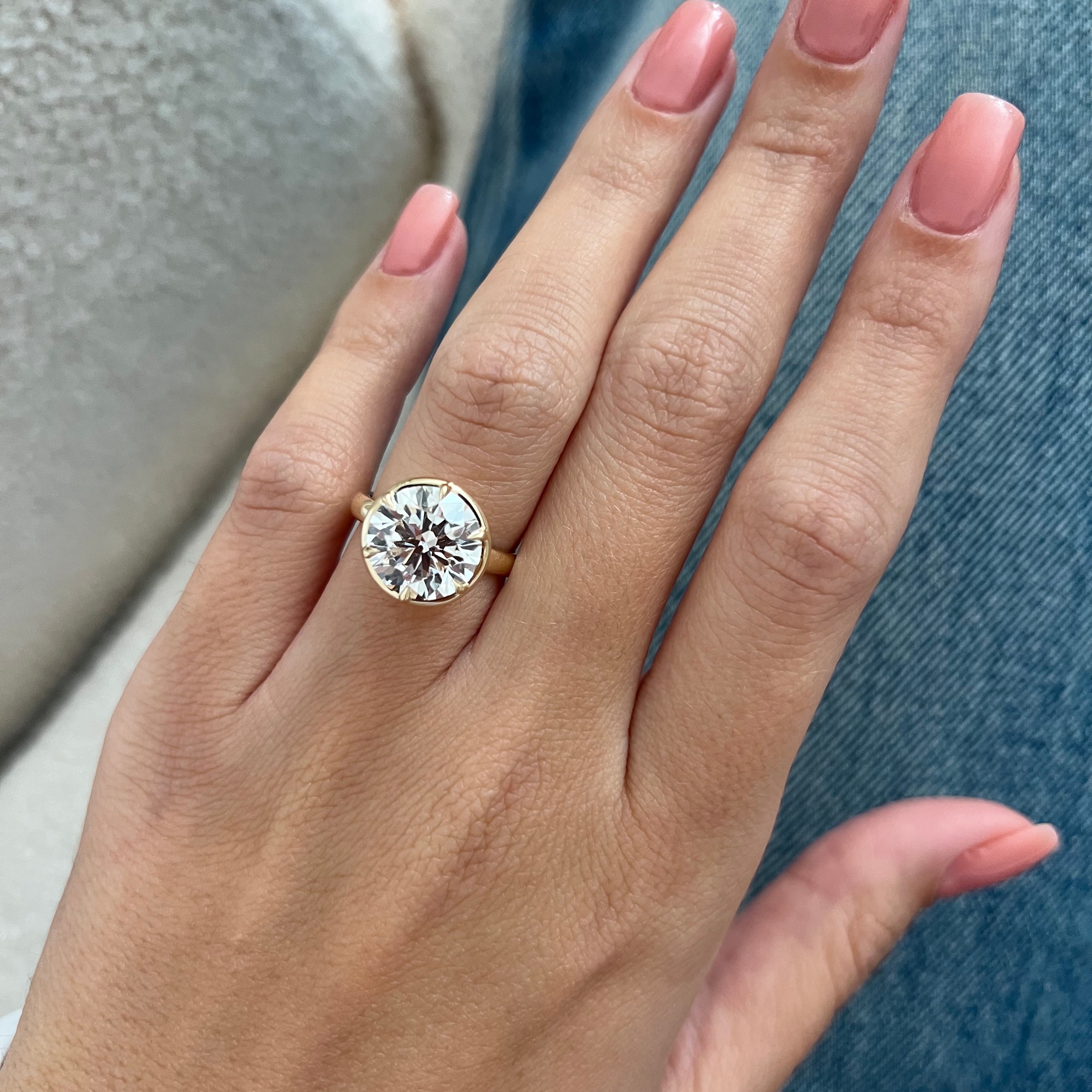5 carat Oval cut lab-grown diamond IGI certified, bezel engagement ring.