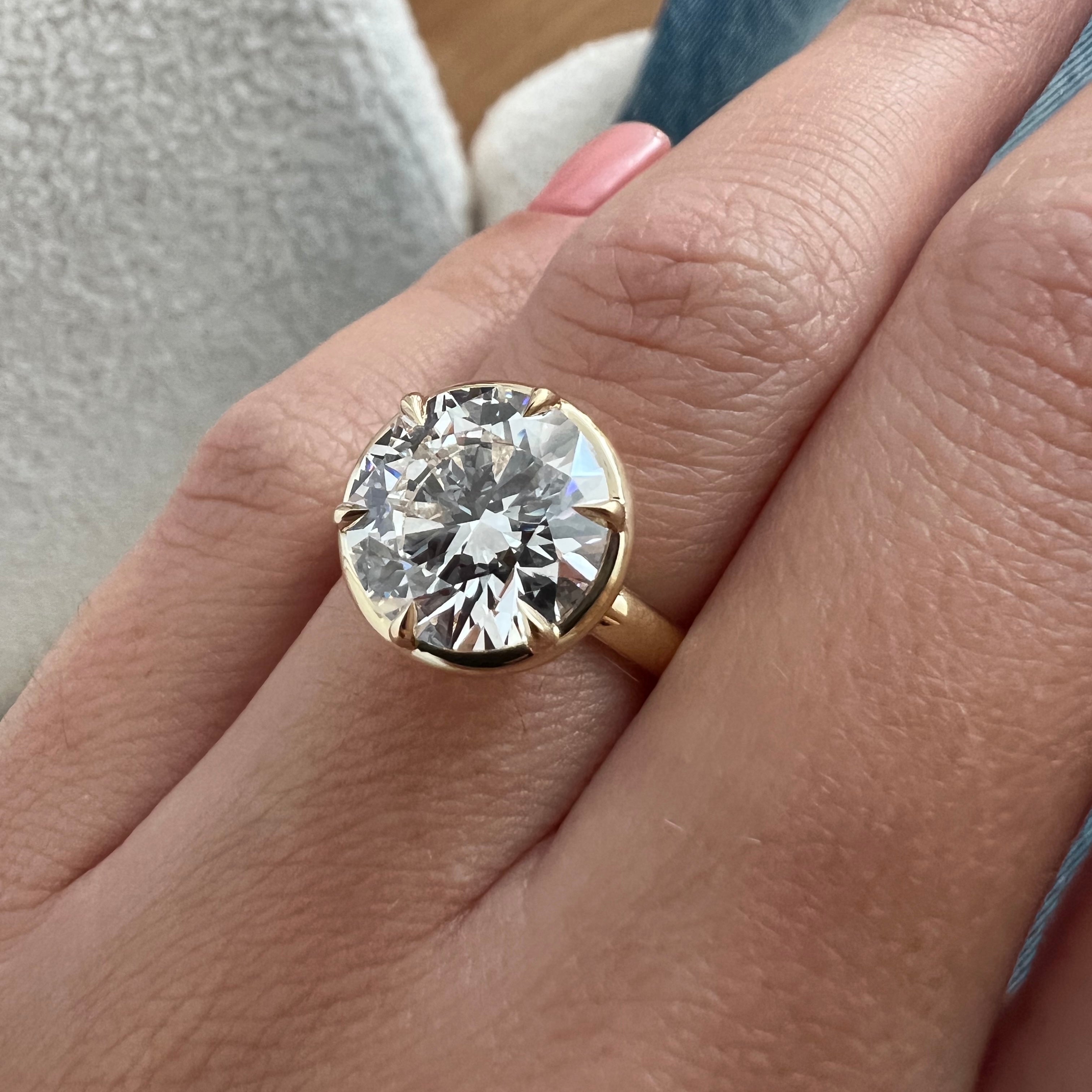 5 carat Oval cut lab-grown diamond IGI certified, bezel engagement ring.