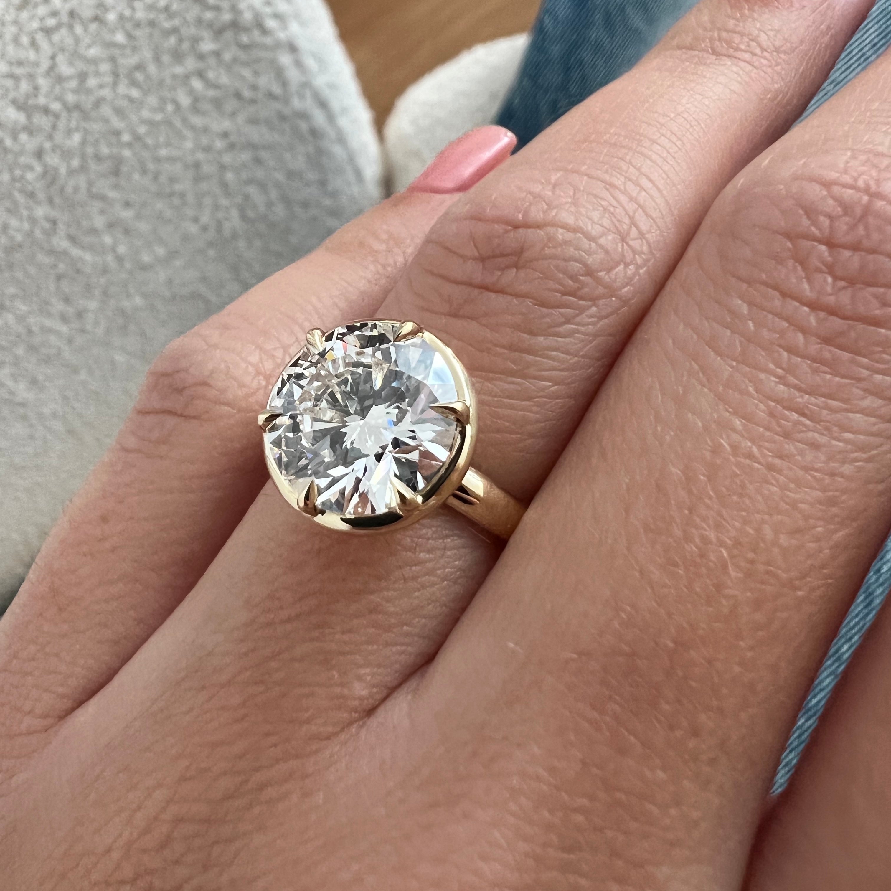 5 carat Oval cut lab-grown diamond IGI certified, bezel engagement ring.