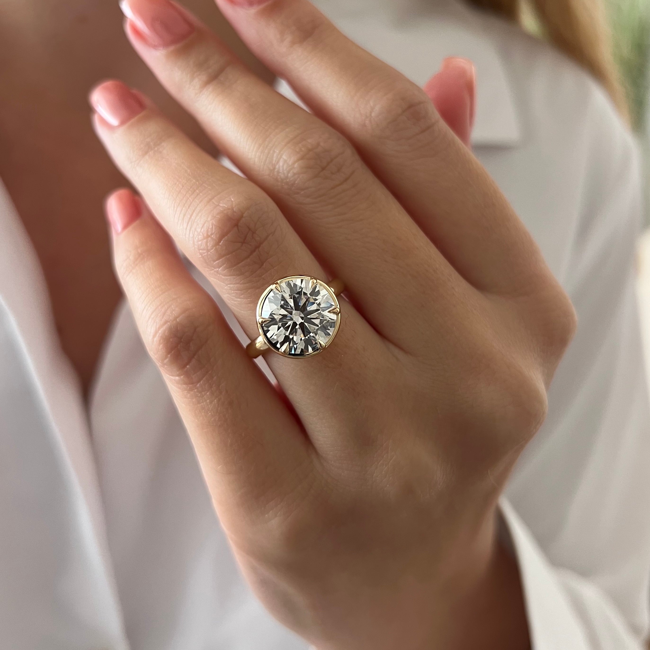 5 carat Oval cut lab-grown diamond IGI certified, bezel engagement ring.
