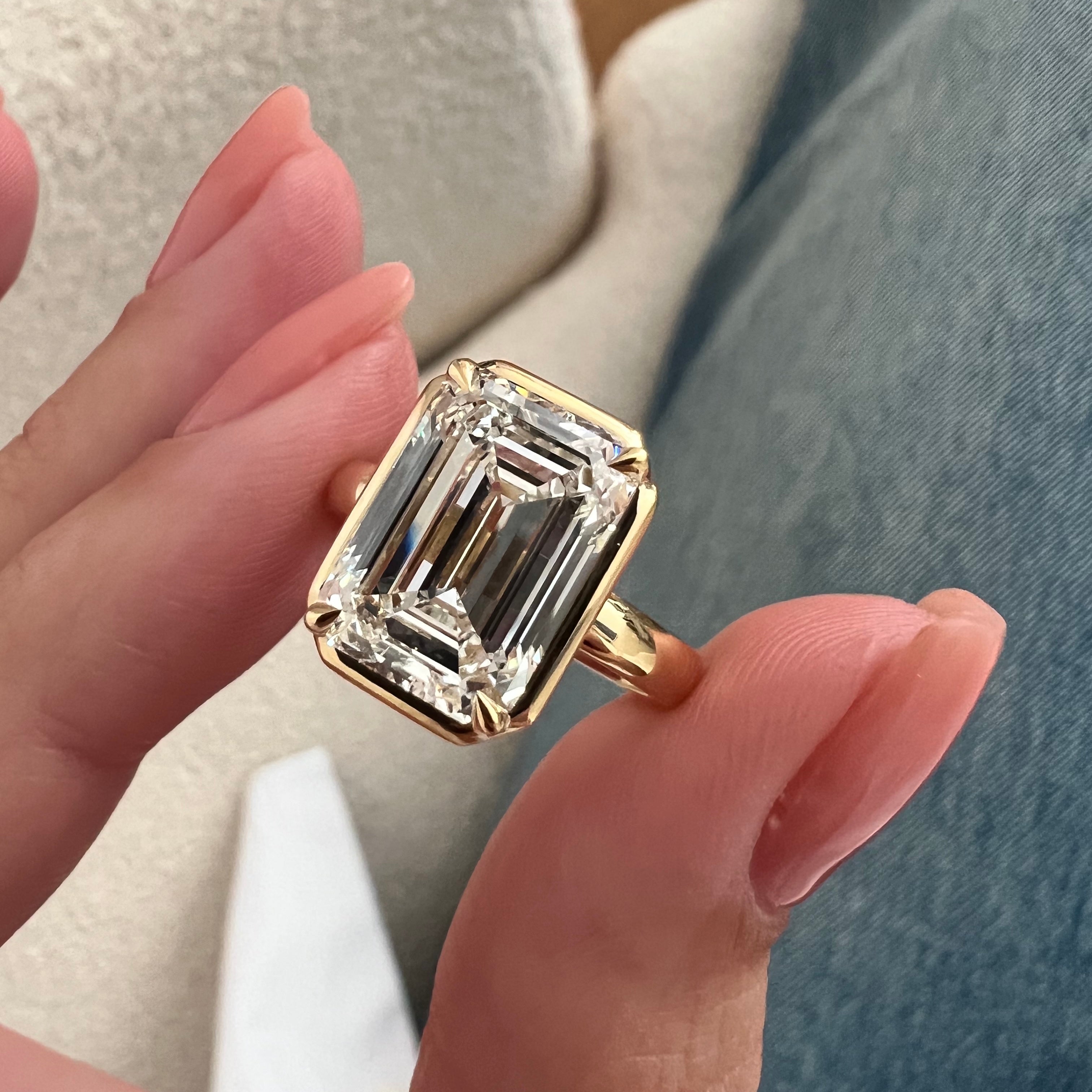 5 carat Oval cut lab-grown diamond IGI certified, bezel engagement ring.