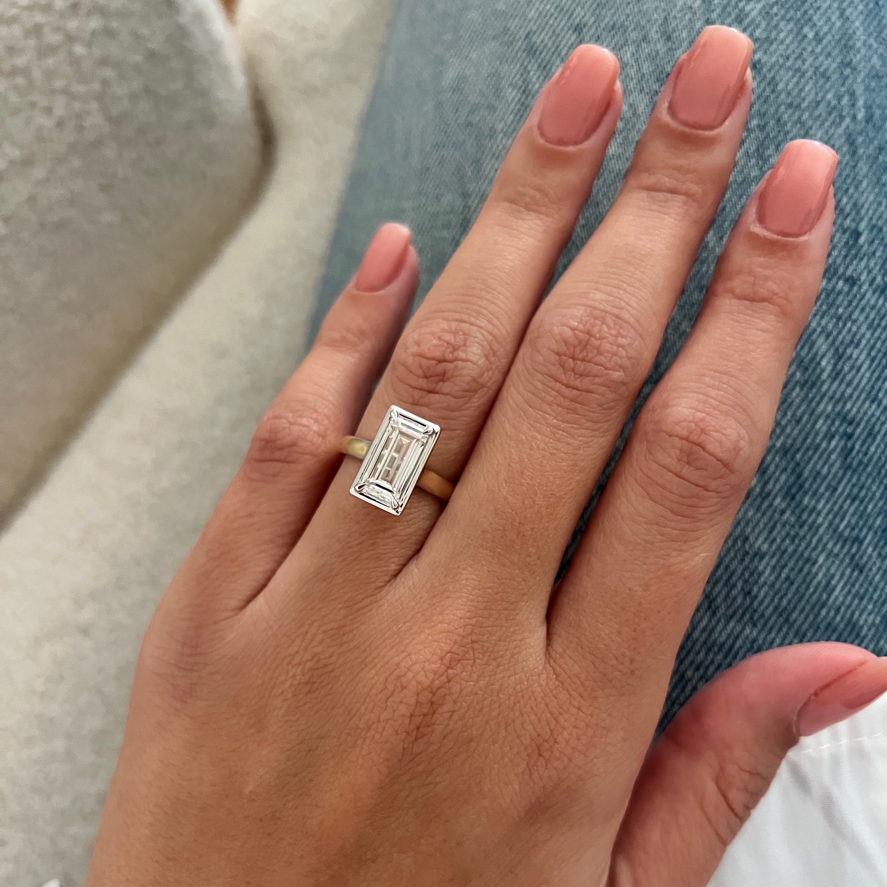 2 carat Oval cut lab-grown diamond IGI certified, bezel engagement ring.
