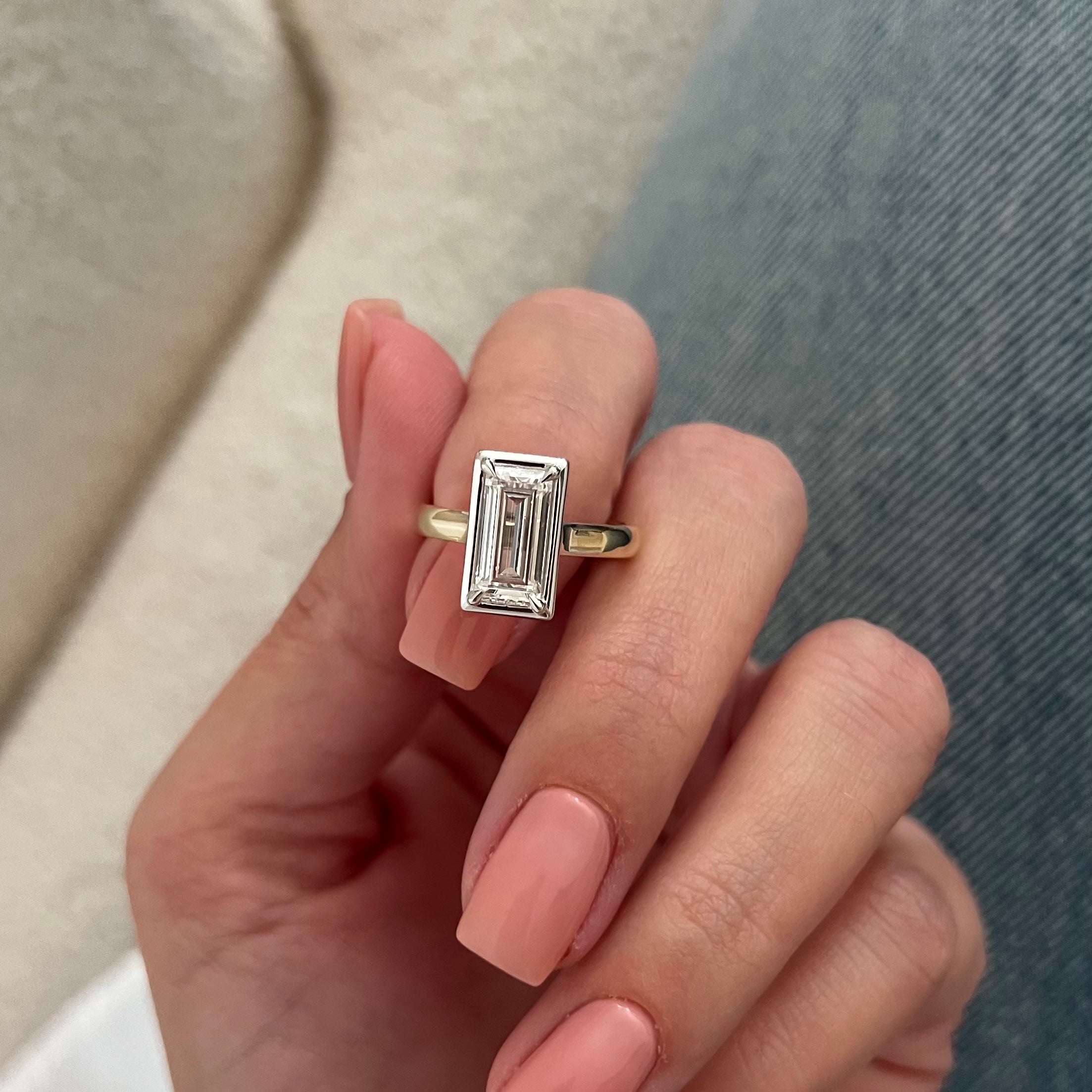 2 carat Oval cut lab-grown diamond IGI certified, bezel engagement ring.