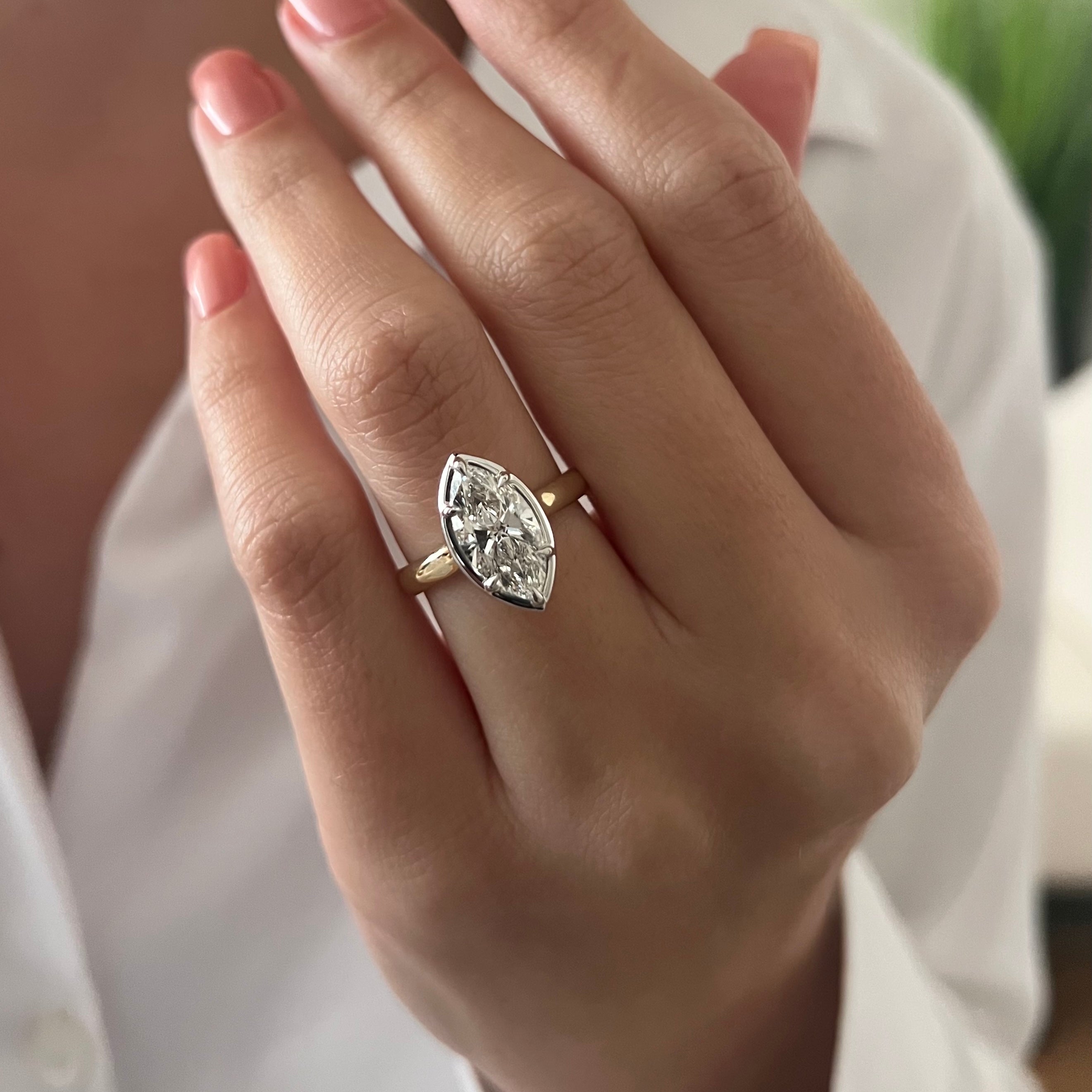2 carat Oval cut lab-grown diamond IGI certified, bezel engagement ring.