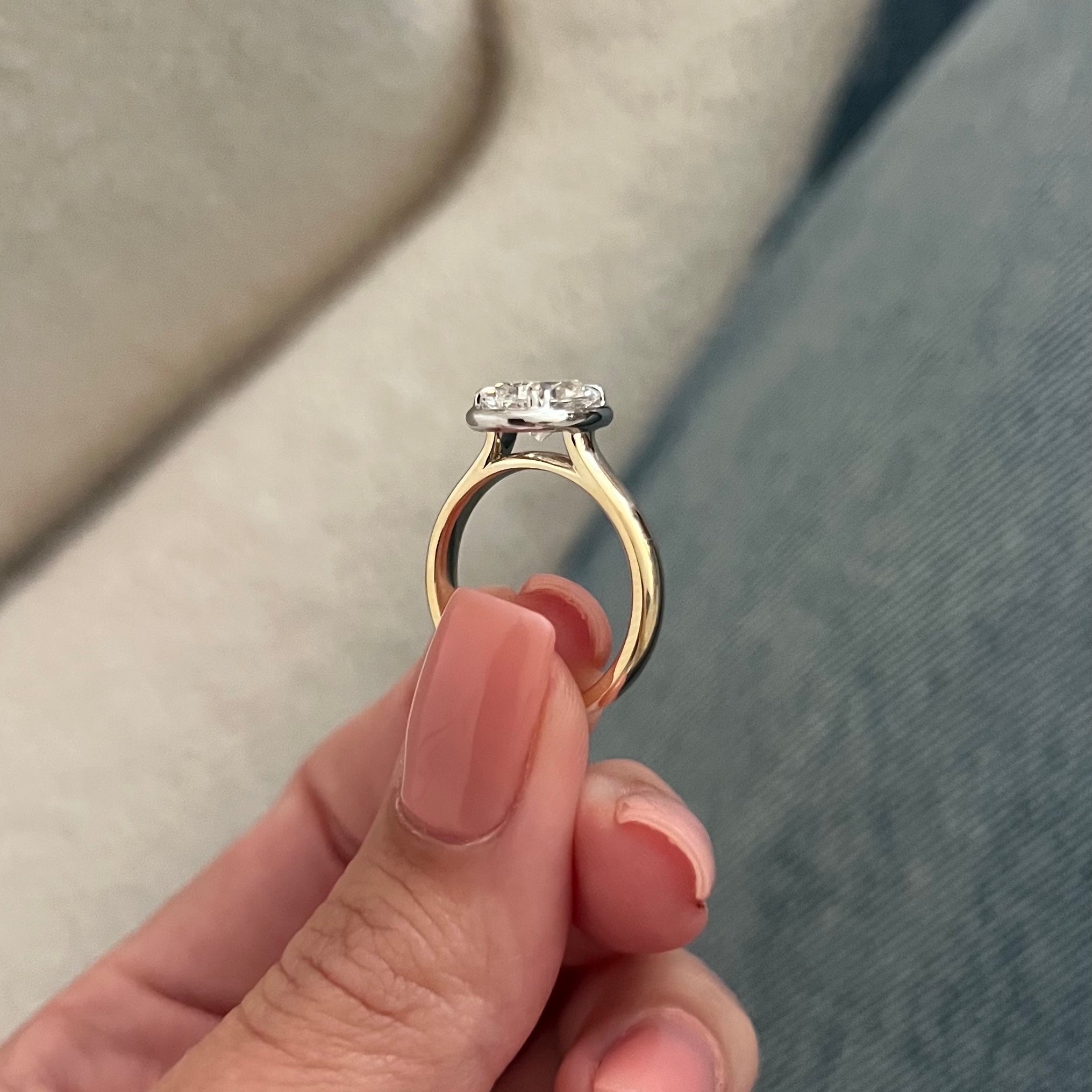 2 carat Oval cut lab-grown diamond IGI certified, bezel engagement ring.