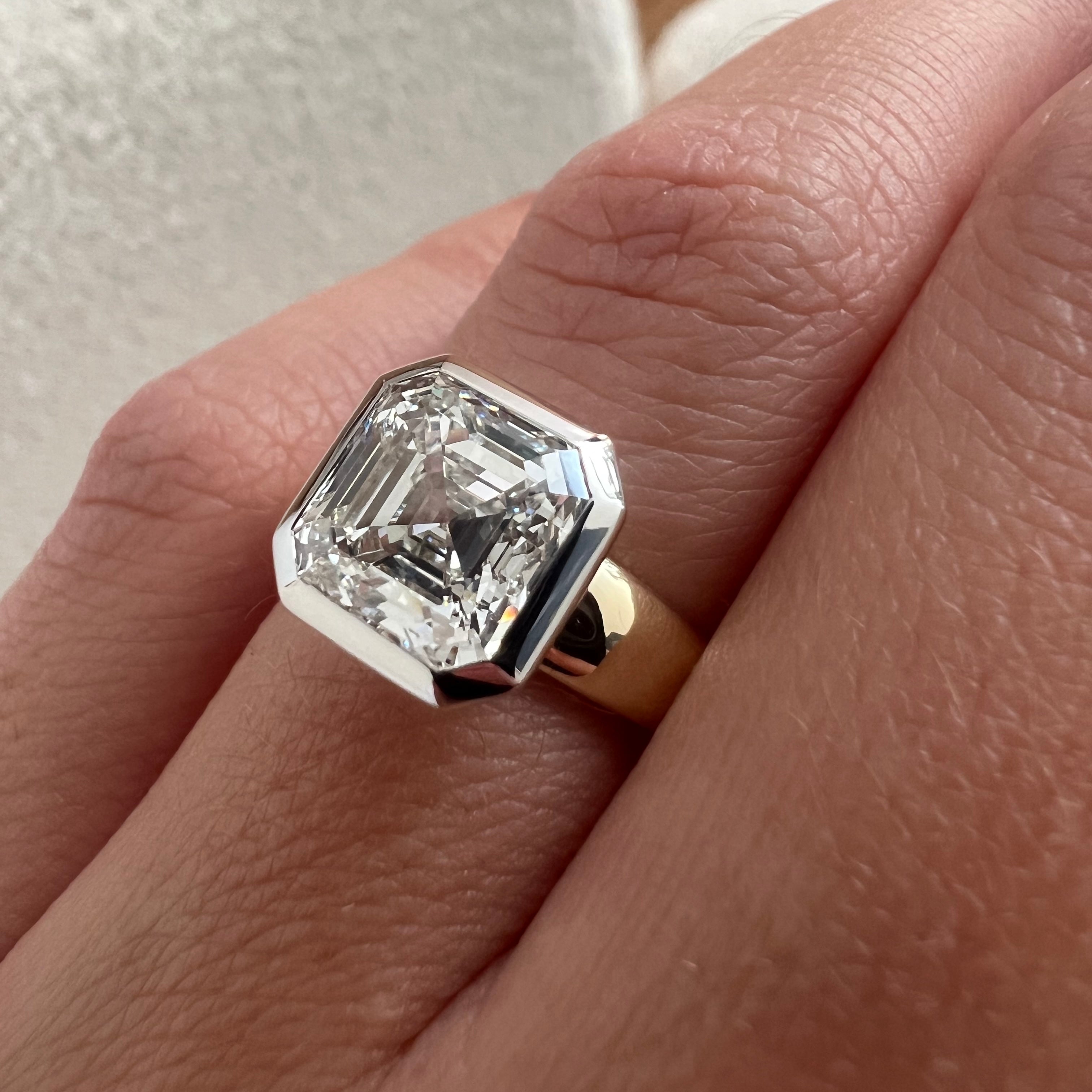 3 carat Oval cut lab-grown diamond IGI certified, bezel engagement ring.