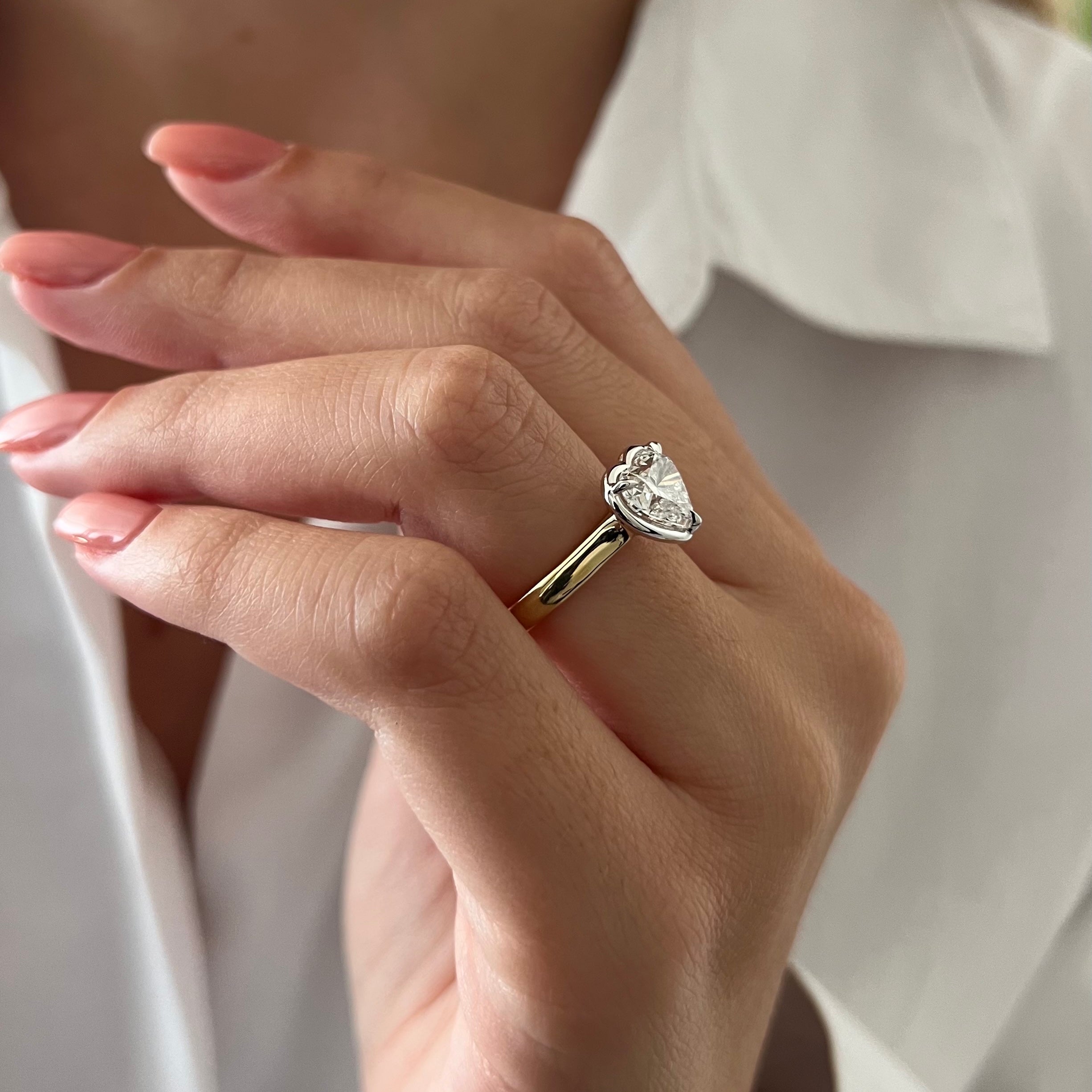 2 carat Oval cut lab-grown diamond IGI certified, bezel engagement ring.