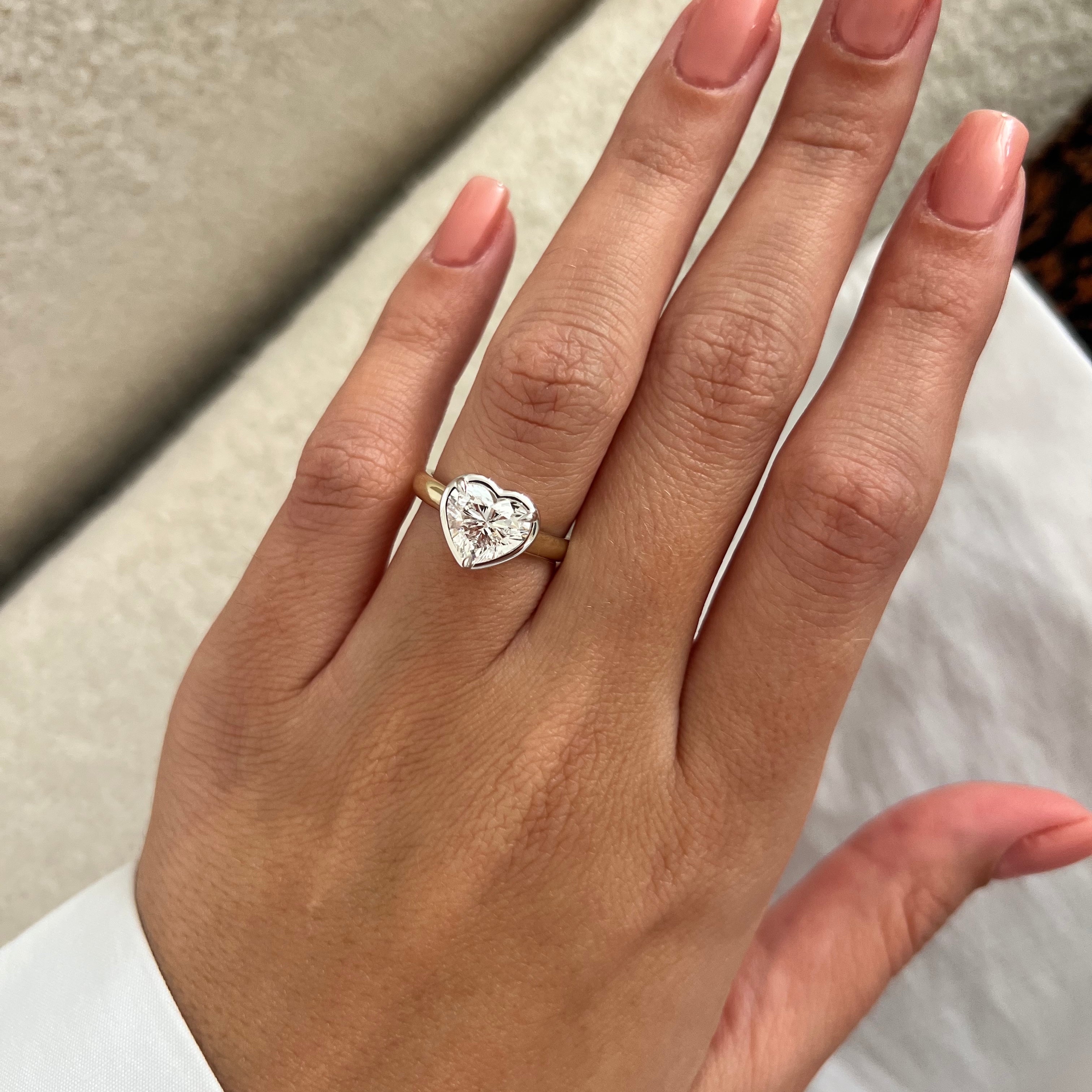 2 carat Oval cut lab-grown diamond IGI certified, bezel engagement ring.