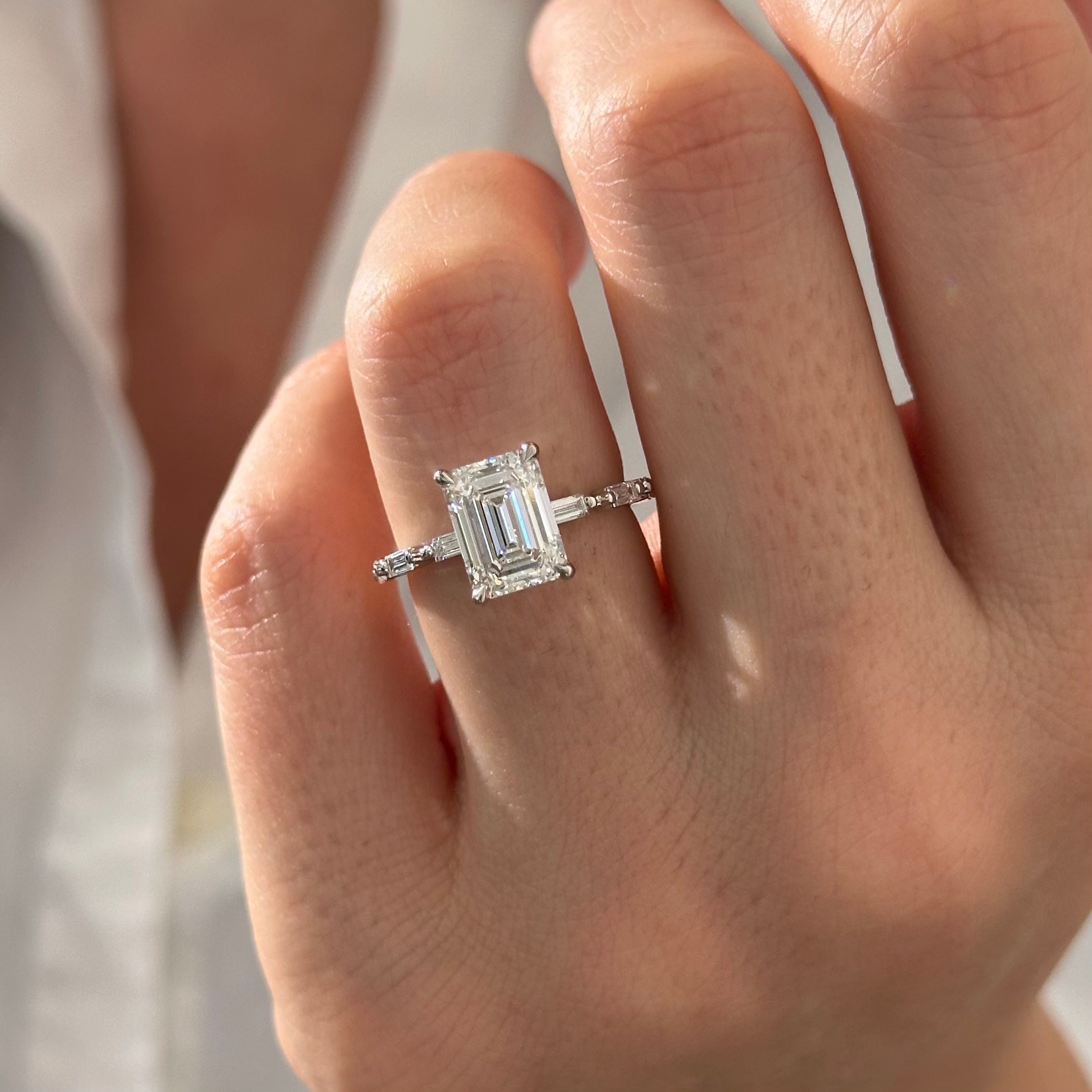 all-groups | 2.5 carat Emerald cut lab-grown diamond IGI certified, side stones engagement ring.
