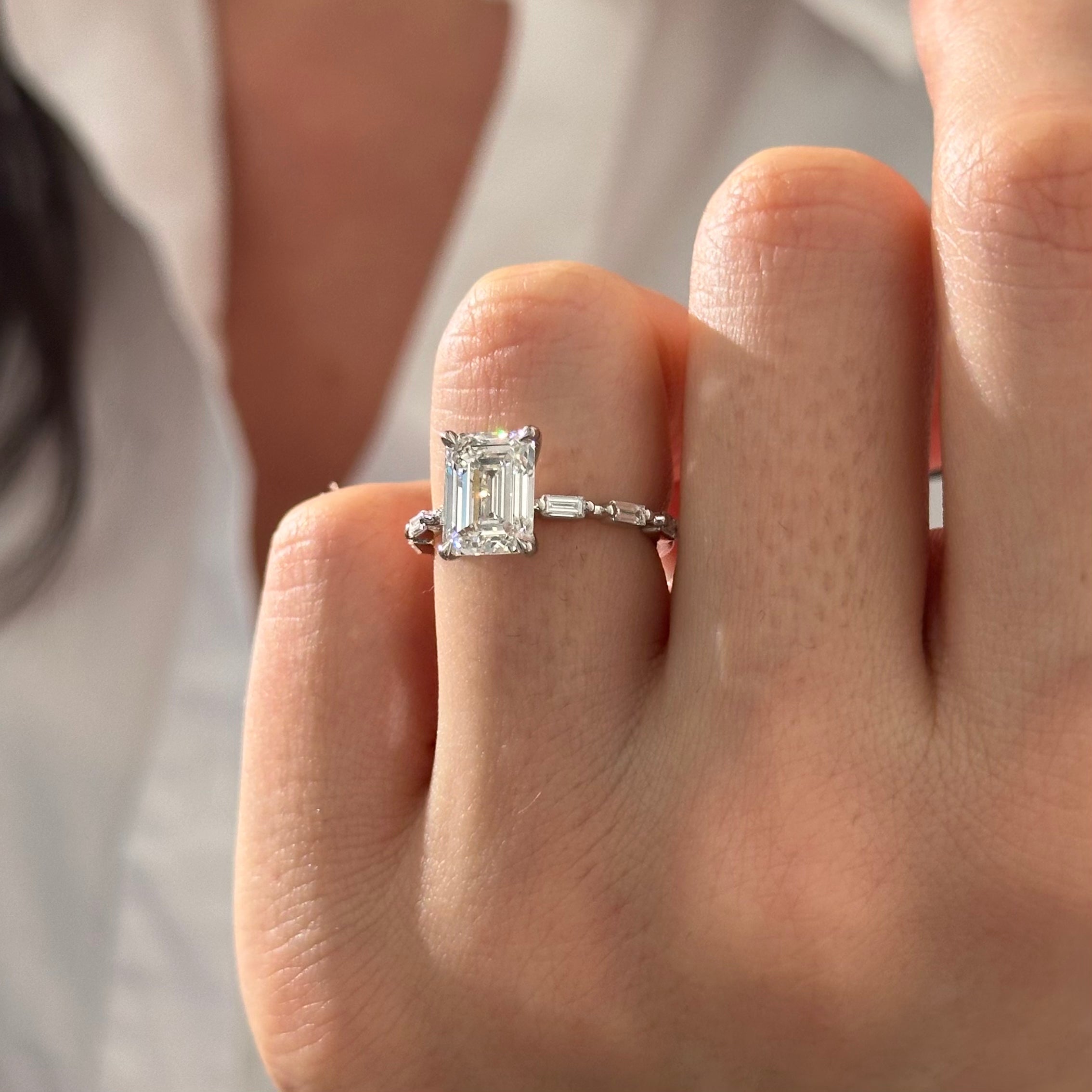 all-groups | 2.5 carat Emerald cut lab-grown diamond IGI certified, side stones engagement ring.
