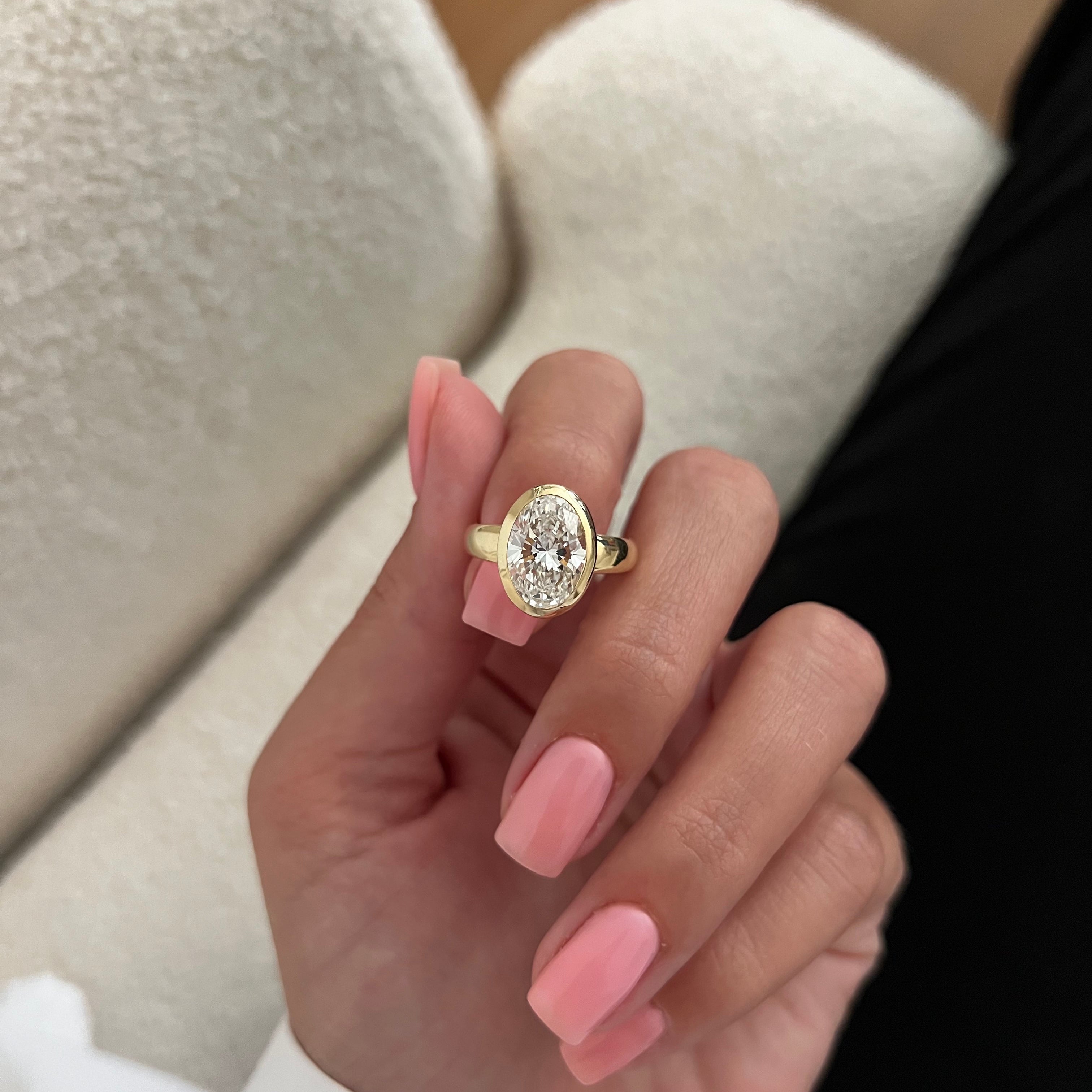 2 carat Oval cut lab-grown diamond IGI certified, bezel engagement ring.