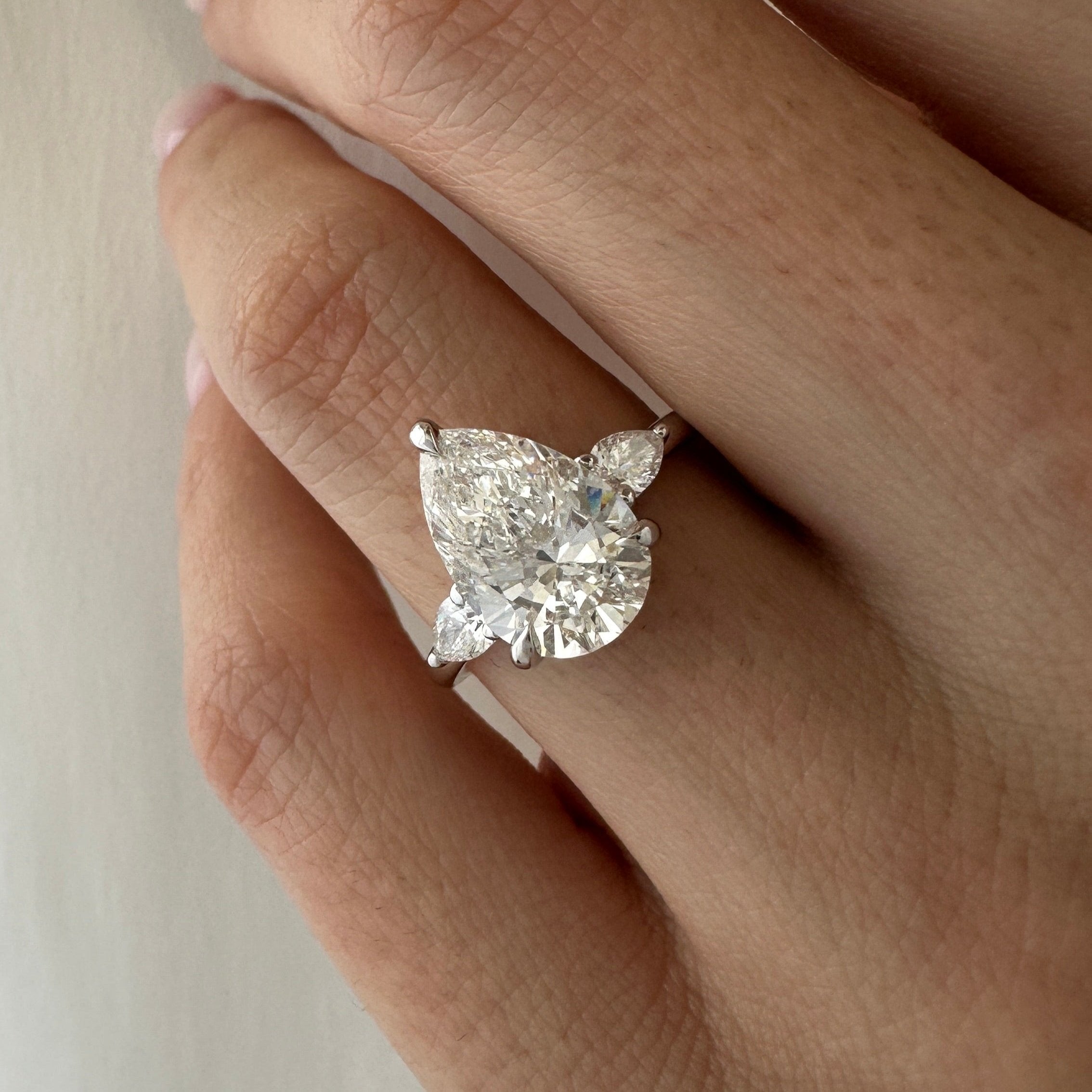 all-groups | 3 carat Pear cut lab-grown diamond IGI certified, three stone engagement ring.