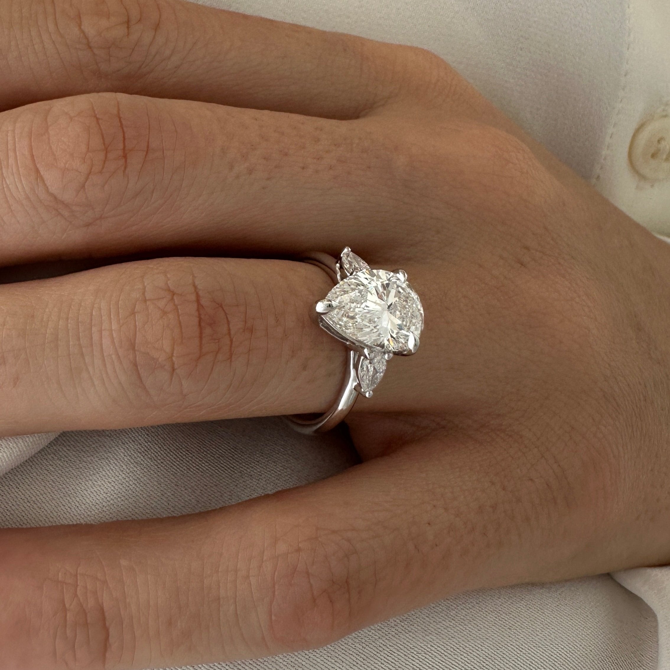 all-groups | 3 carat Pear cut lab-grown diamond IGI certified, three stone engagement ring.