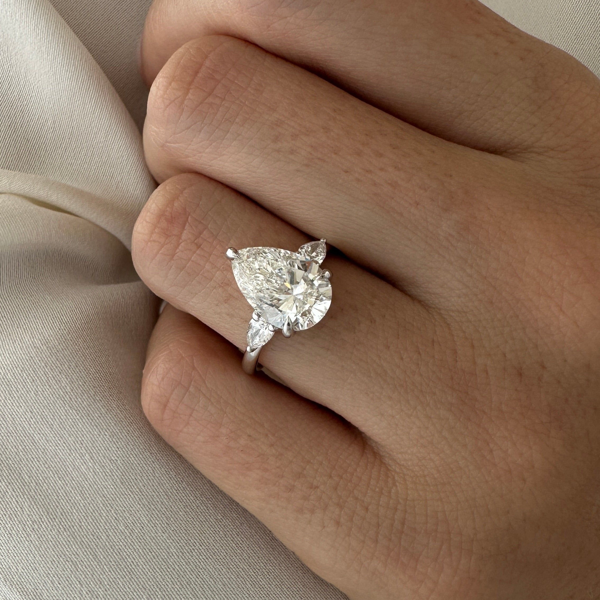 all-groups | 3 carat Pear cut lab-grown diamond IGI certified, three stone engagement ring.