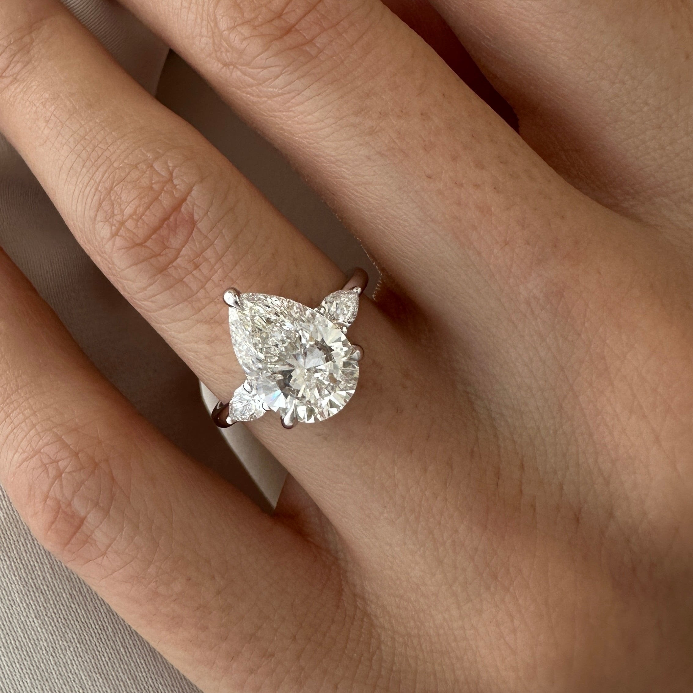 all-groups | 3 carat Pear cut lab-grown diamond IGI certified, three stone engagement ring.
