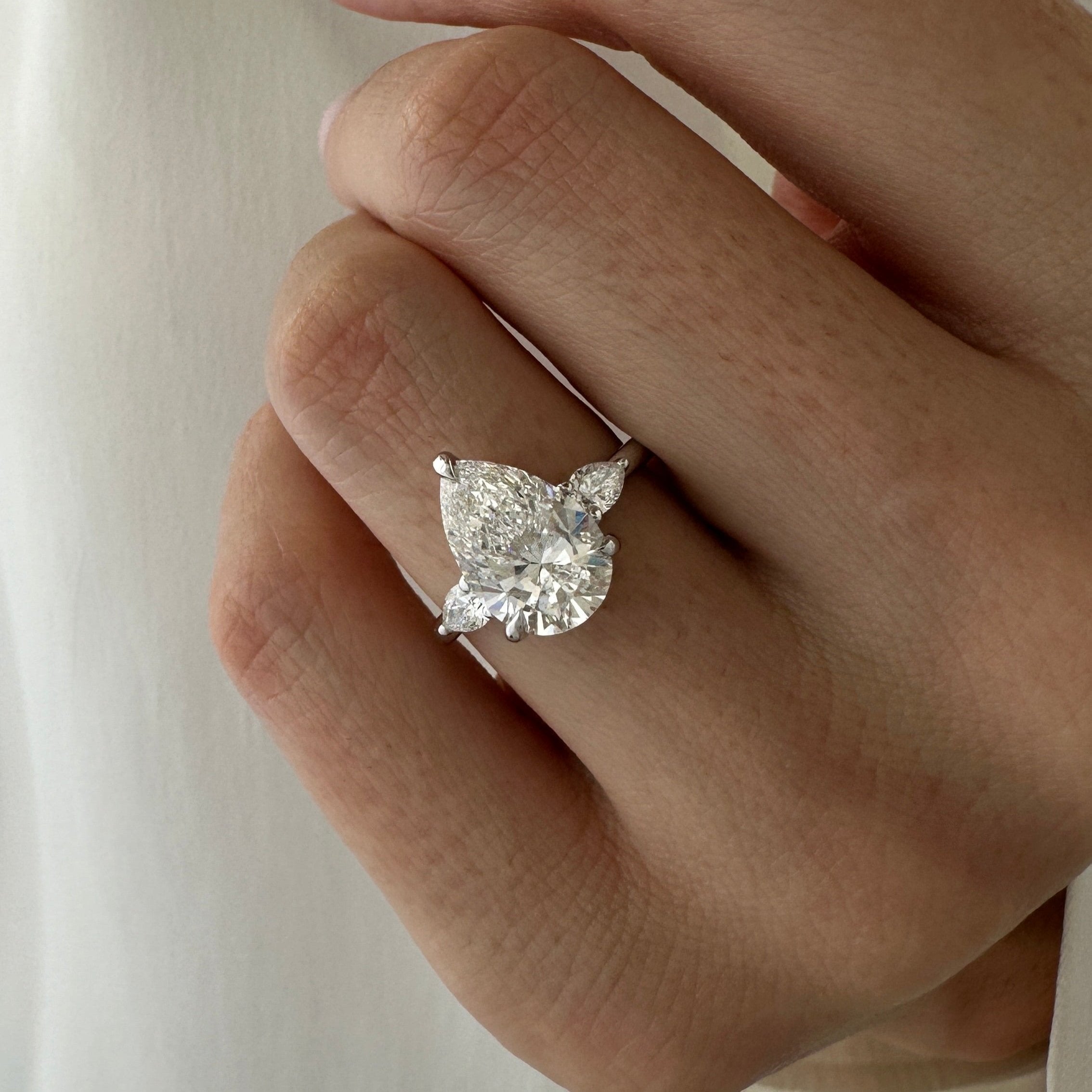 all-groups | 3 carat Pear cut lab-grown diamond IGI certified, three stone engagement ring.