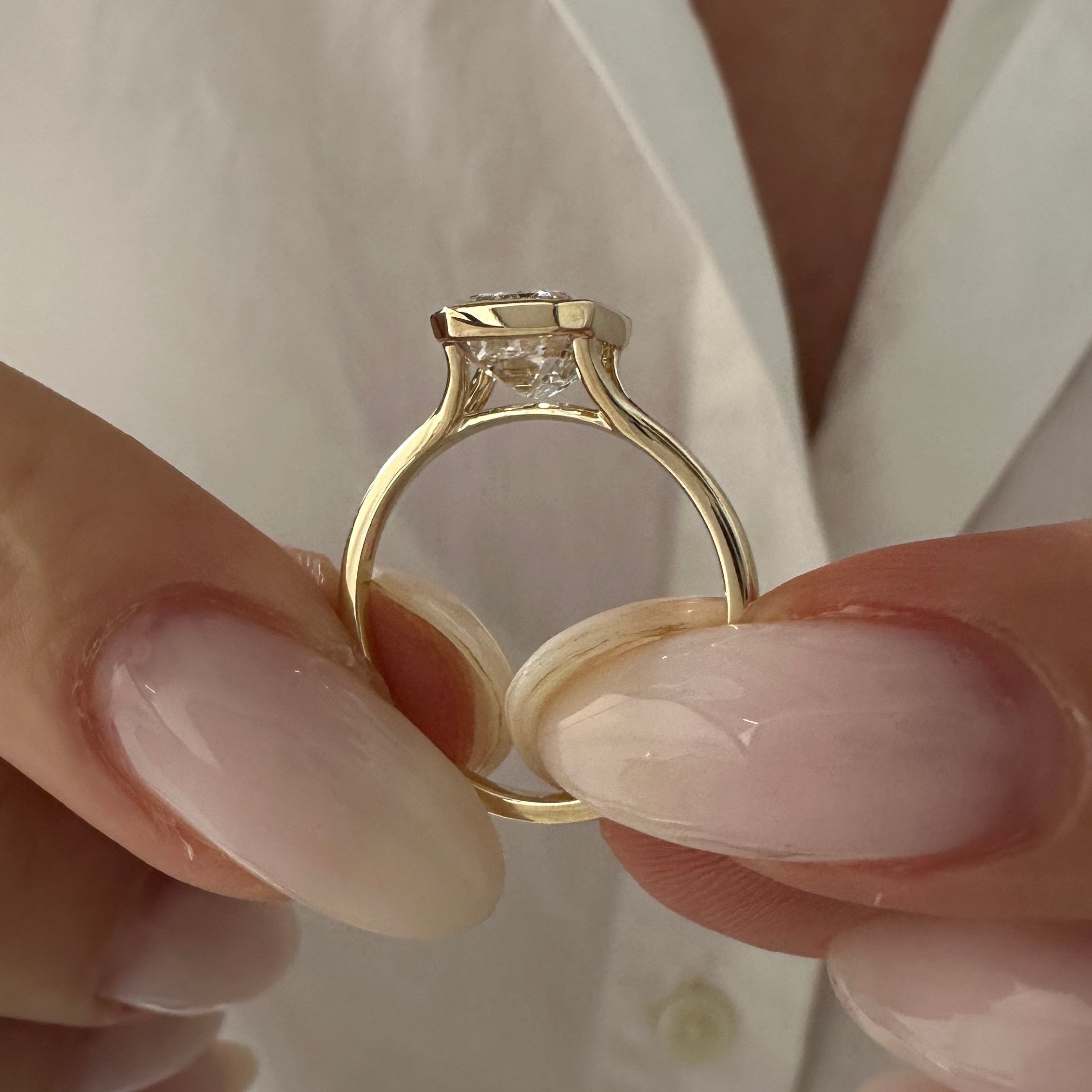 all-groups | 2.5 carat Emerald cut lab-grown diamond IGI certified, bezel engagement ring.