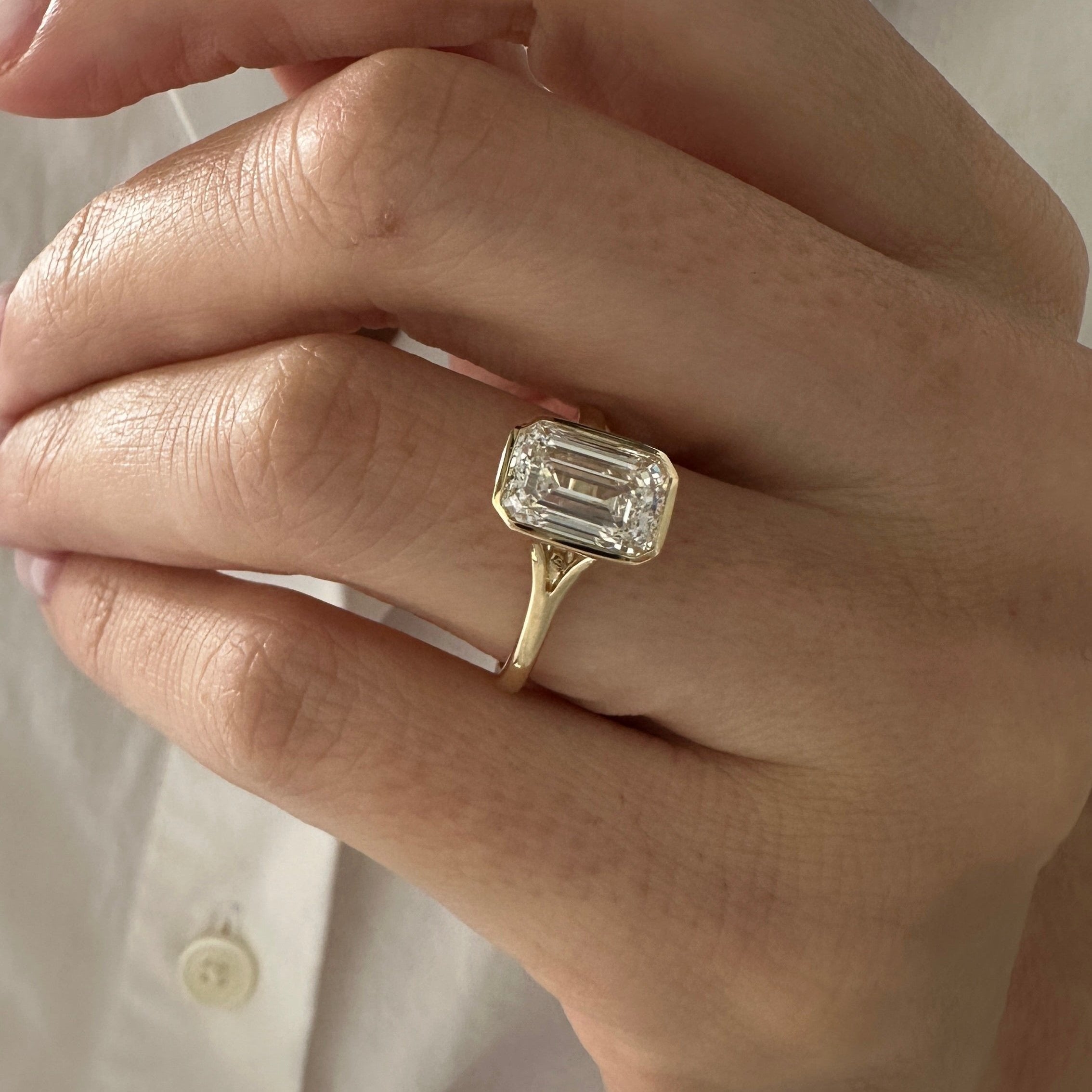 all-groups | 2.5 carat Emerald cut lab-grown diamond IGI certified, bezel engagement ring.