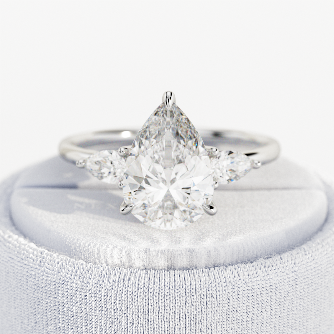 3 carat Pear cut lab-grown diamond IGI certified, three stone engagement ring.