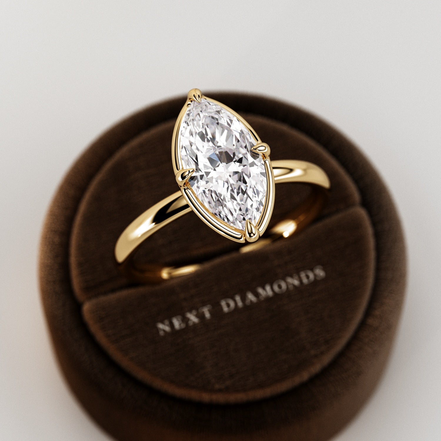 2 carat Elongated Cushion cut lab-grown diamond IGI certified, bezel engagement ring in 14K Yellow Gold.