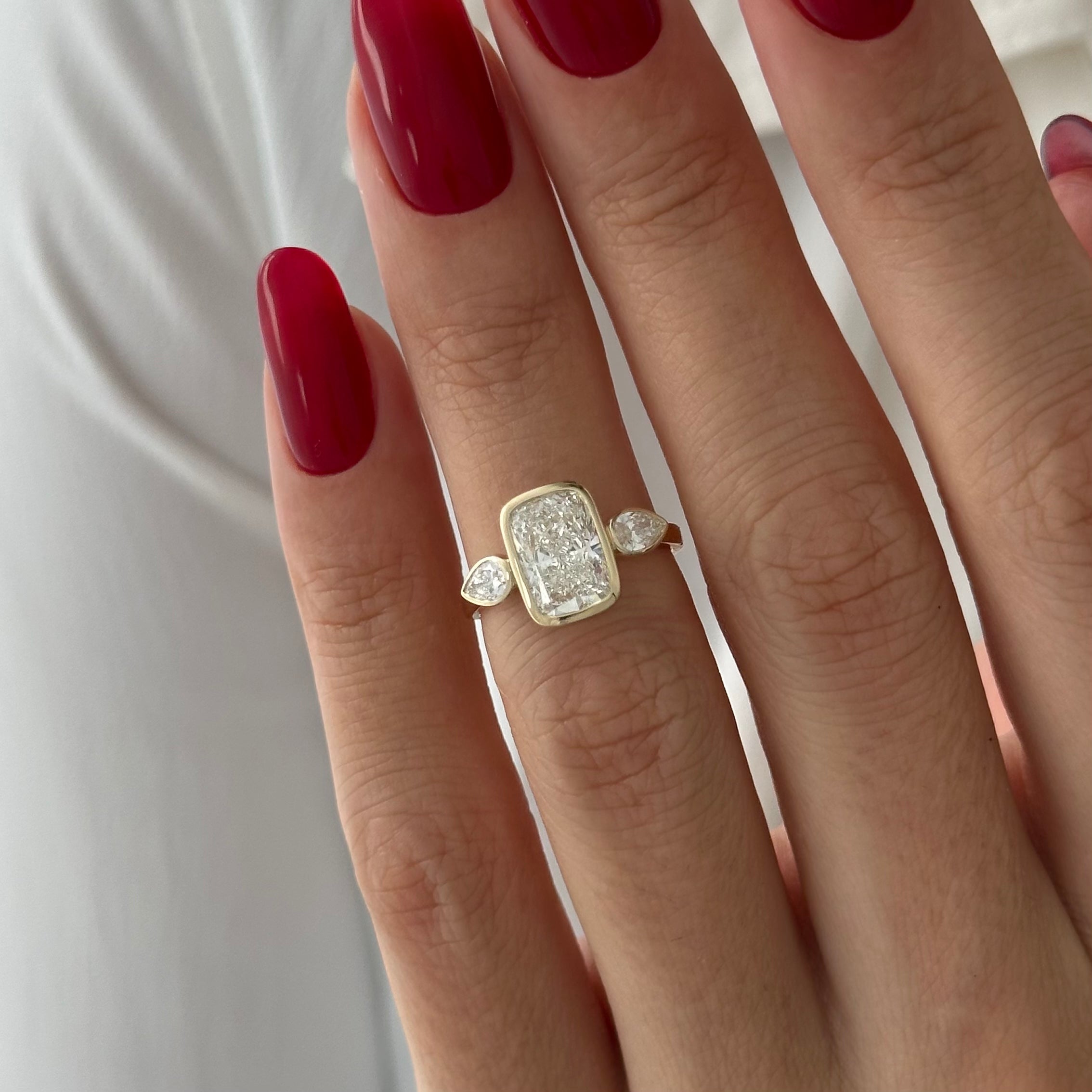 2 carat Elongated Cushion cut lab-grown diamond IGI certified, bezel engagement ring.