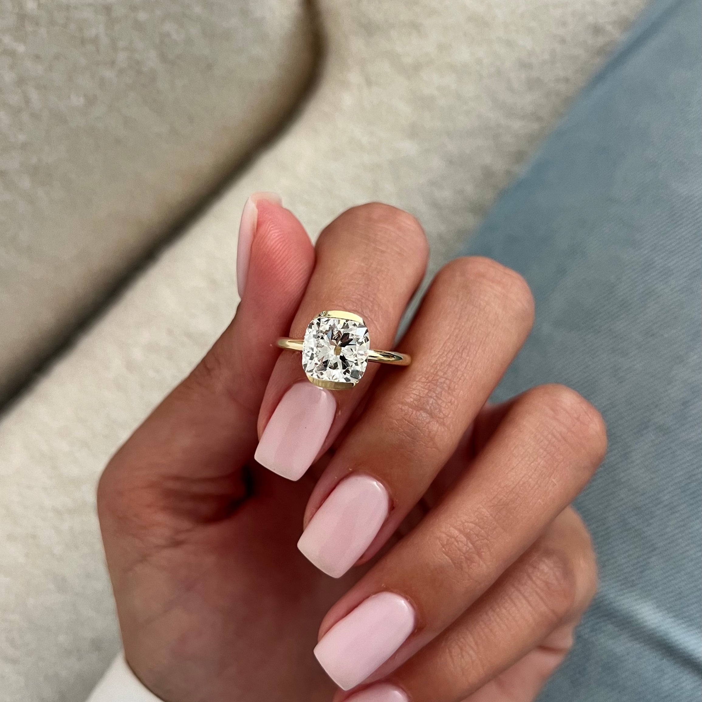 all-groups | 2 carat Oval cut lab-grown diamond IGI certified, bezel engagement ring.
