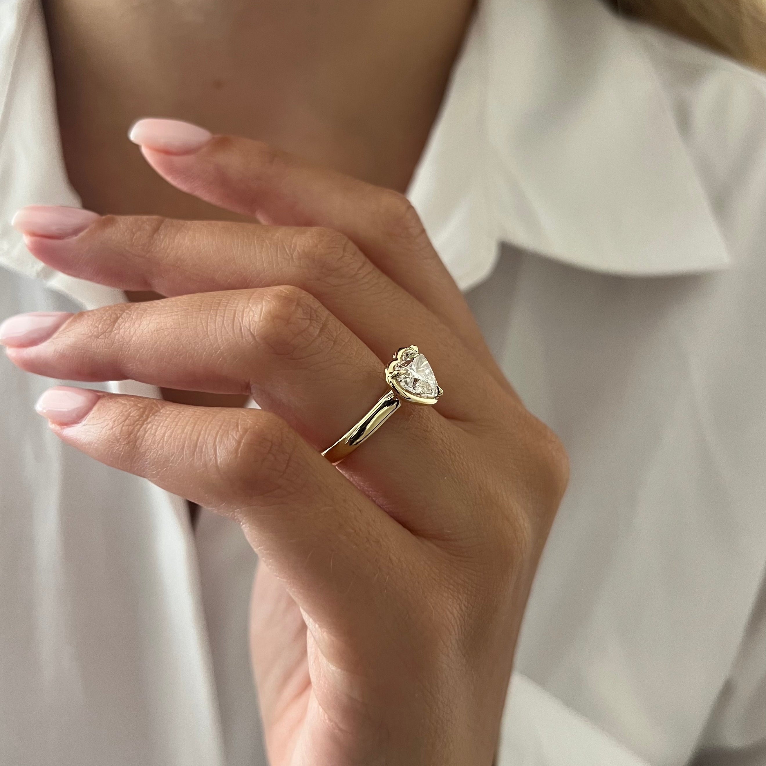 2 carat Oval cut lab-grown diamond IGI certified, bezel engagement ring.