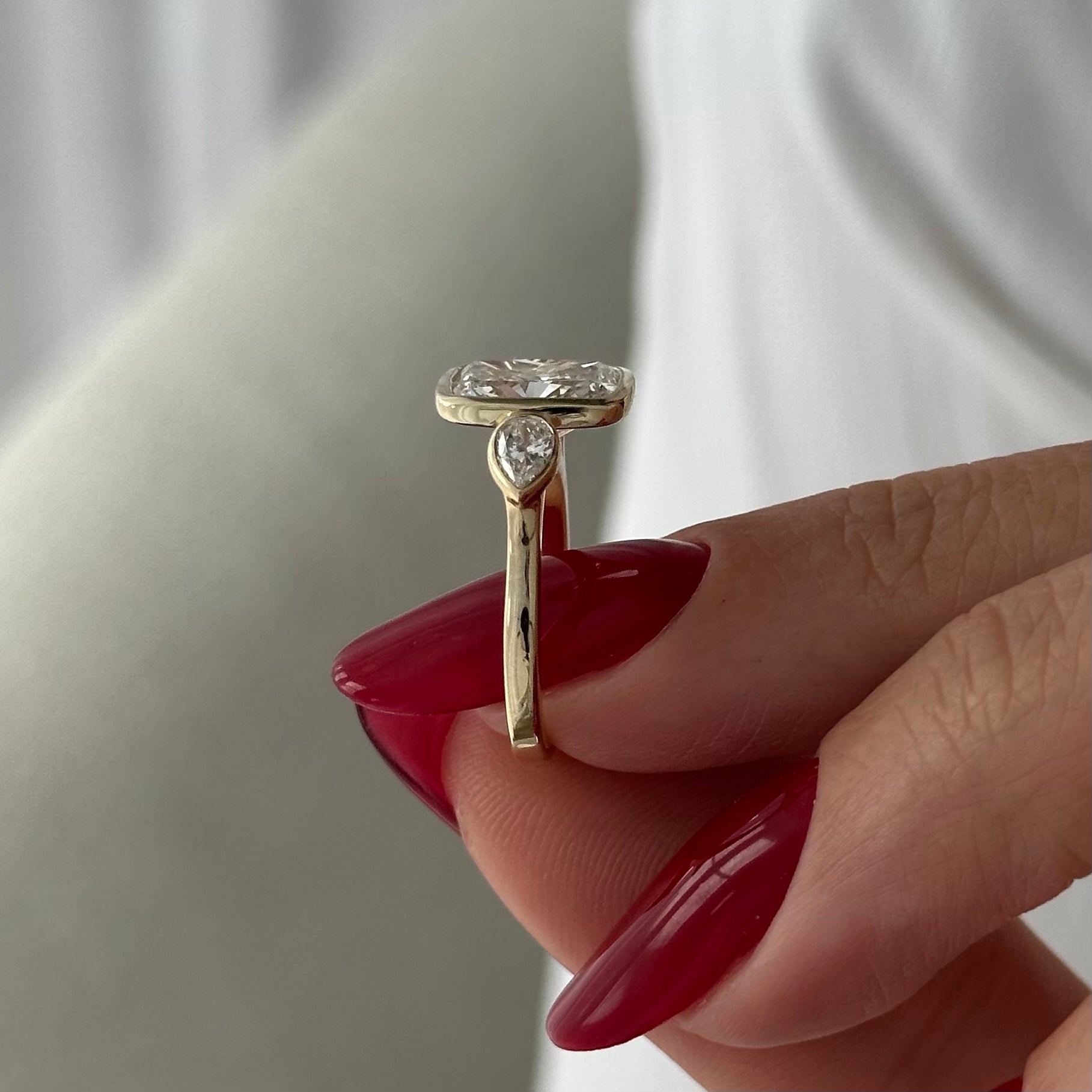 2 carat Elongated Cushion cut lab-grown diamond IGI certified, bezel engagement ring.