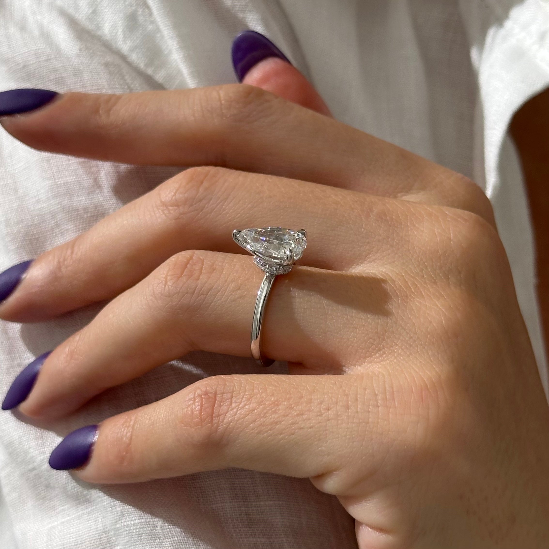 3 carat Pear cut lab-grown diamond IGI certified, hidden halo engagement ring.