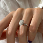 3 carat Pear cut lab-grown diamond IGI certified, hidden halo engagement ring.