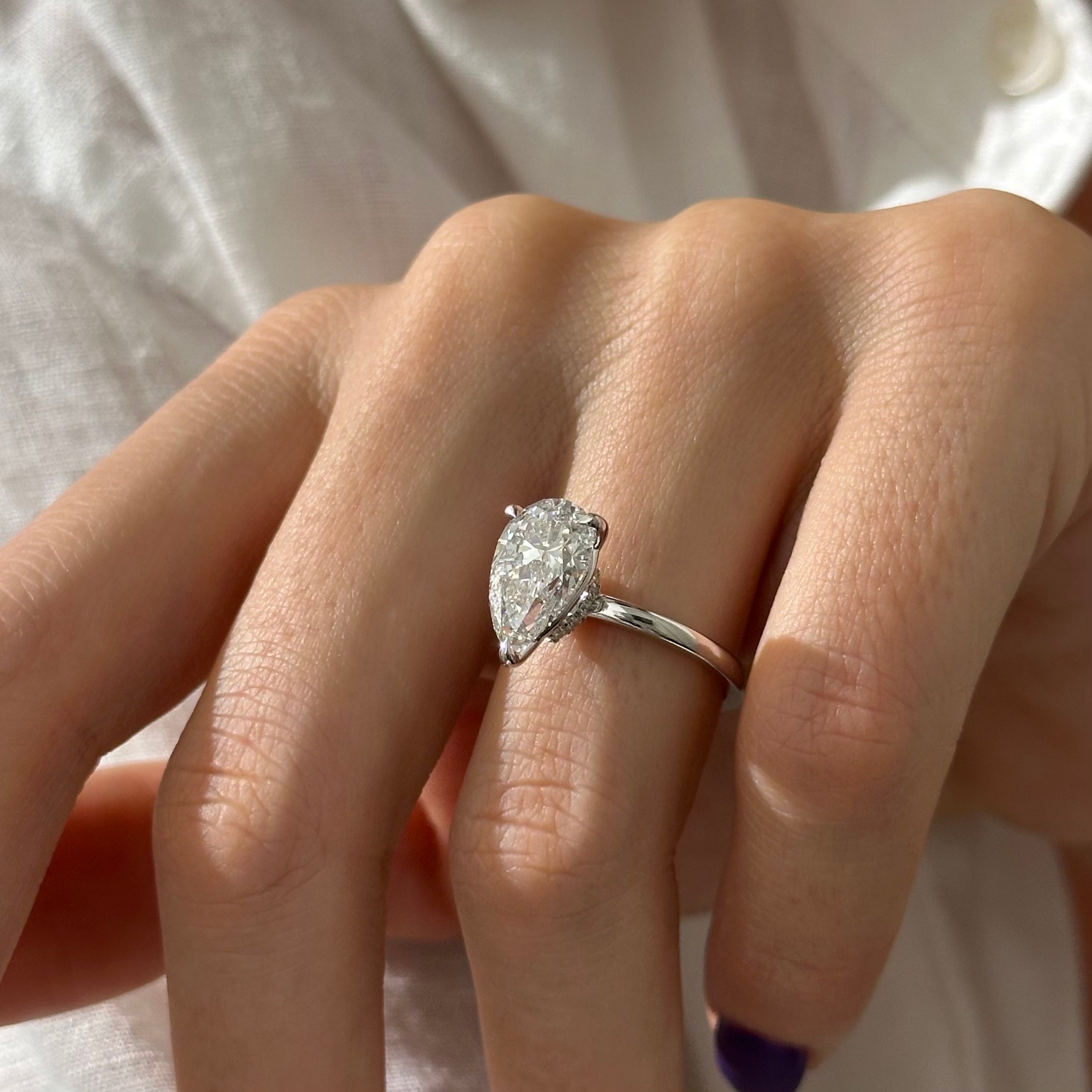 3 carat Pear cut lab-grown diamond IGI certified, hidden halo engagement ring.