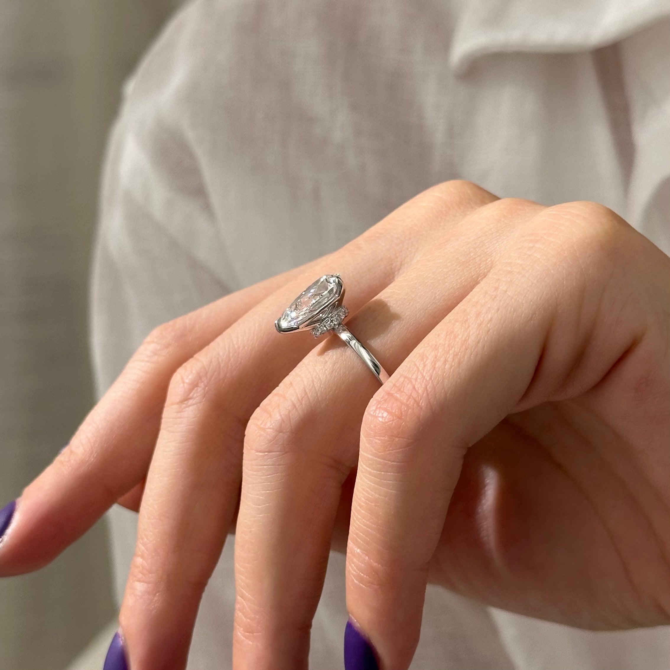 3 carat Pear cut lab-grown diamond IGI certified, hidden halo engagement ring.