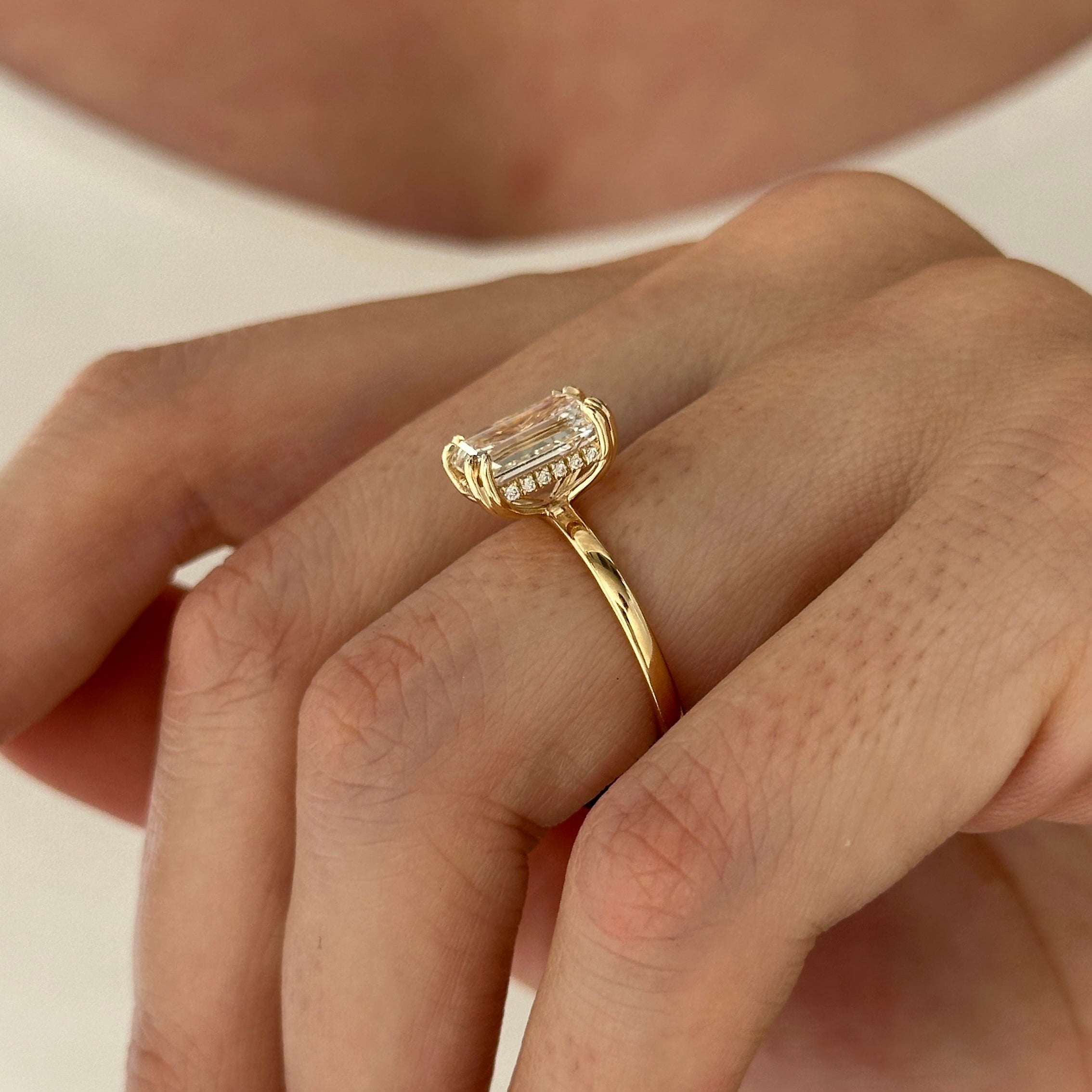 3 carat Emerald cut lab-grown diamond IGI certified, hidden halo engagement ring.