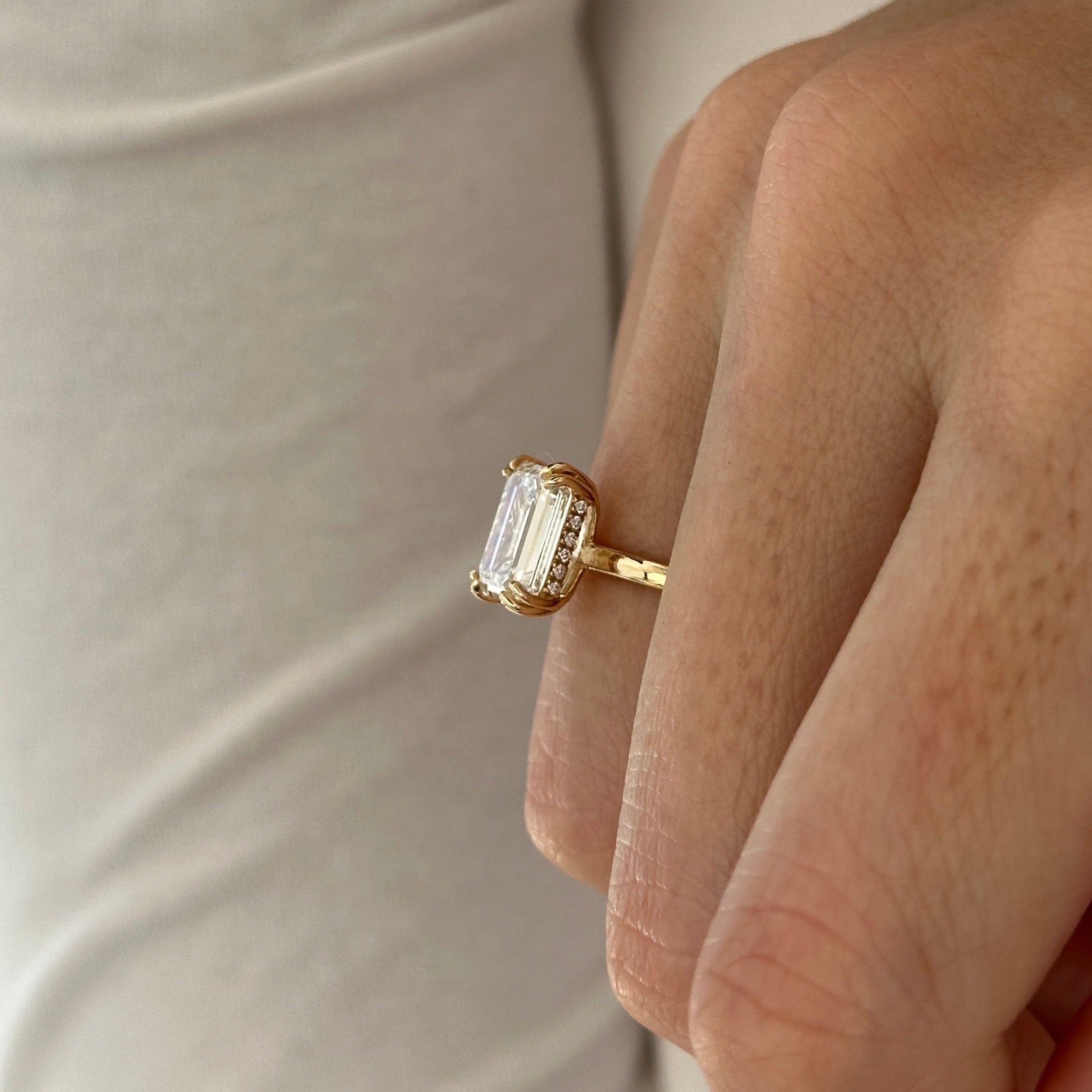 3 carat Emerald cut lab-grown diamond IGI certified, hidden halo engagement ring.