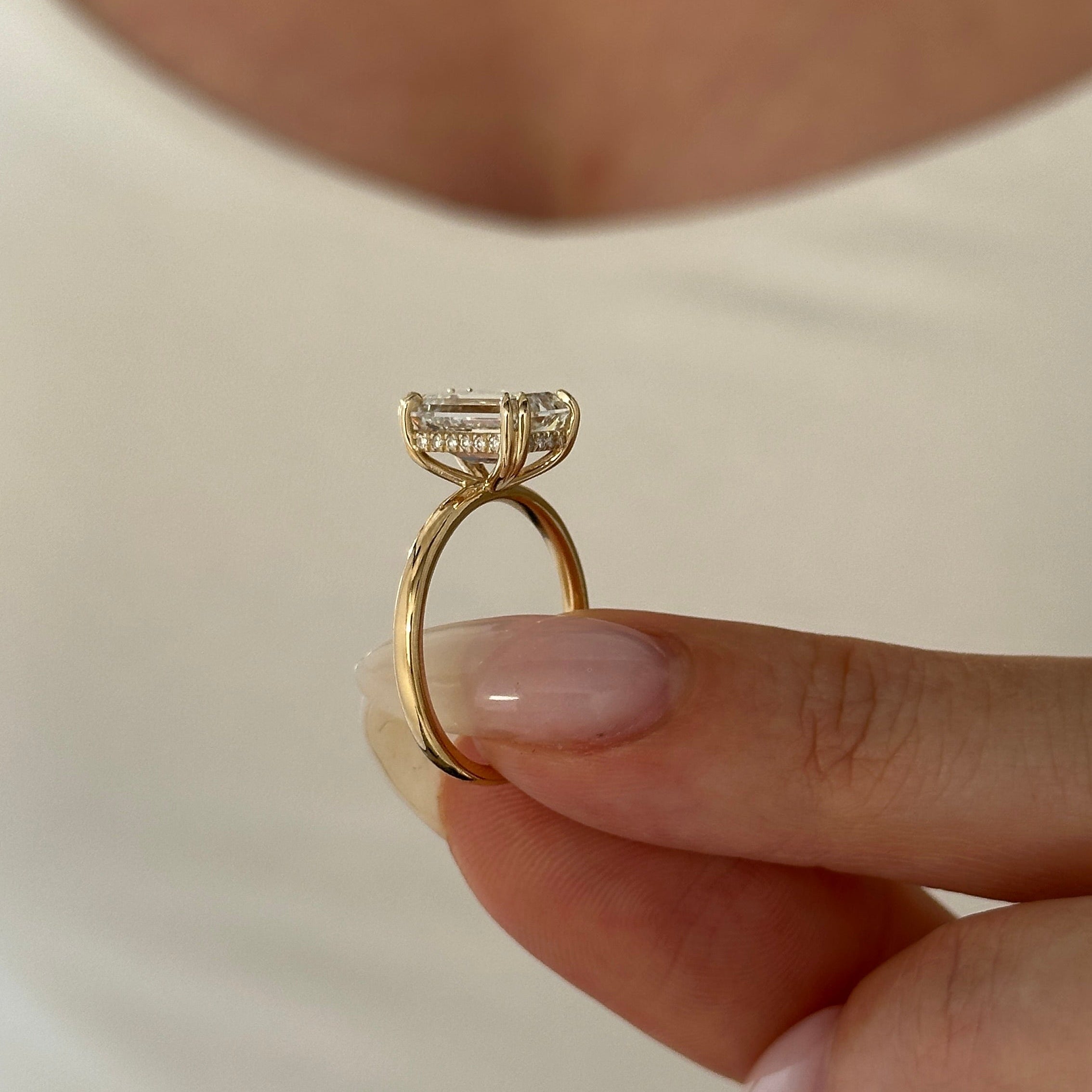 3 carat Emerald cut lab-grown diamond IGI certified, hidden halo engagement ring.