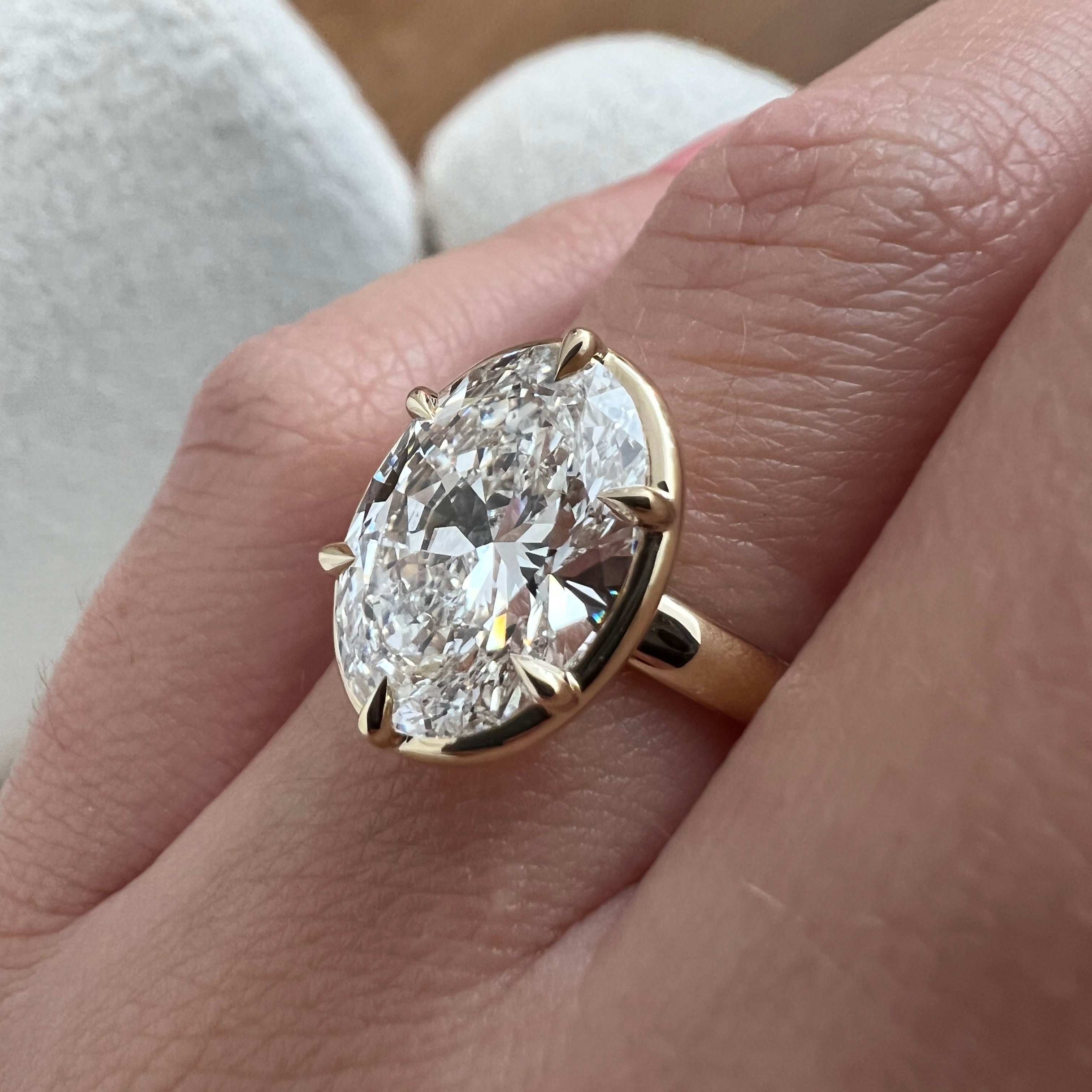 5 carat Oval cut lab-grown diamond IGI certified, bezel engagement ring.