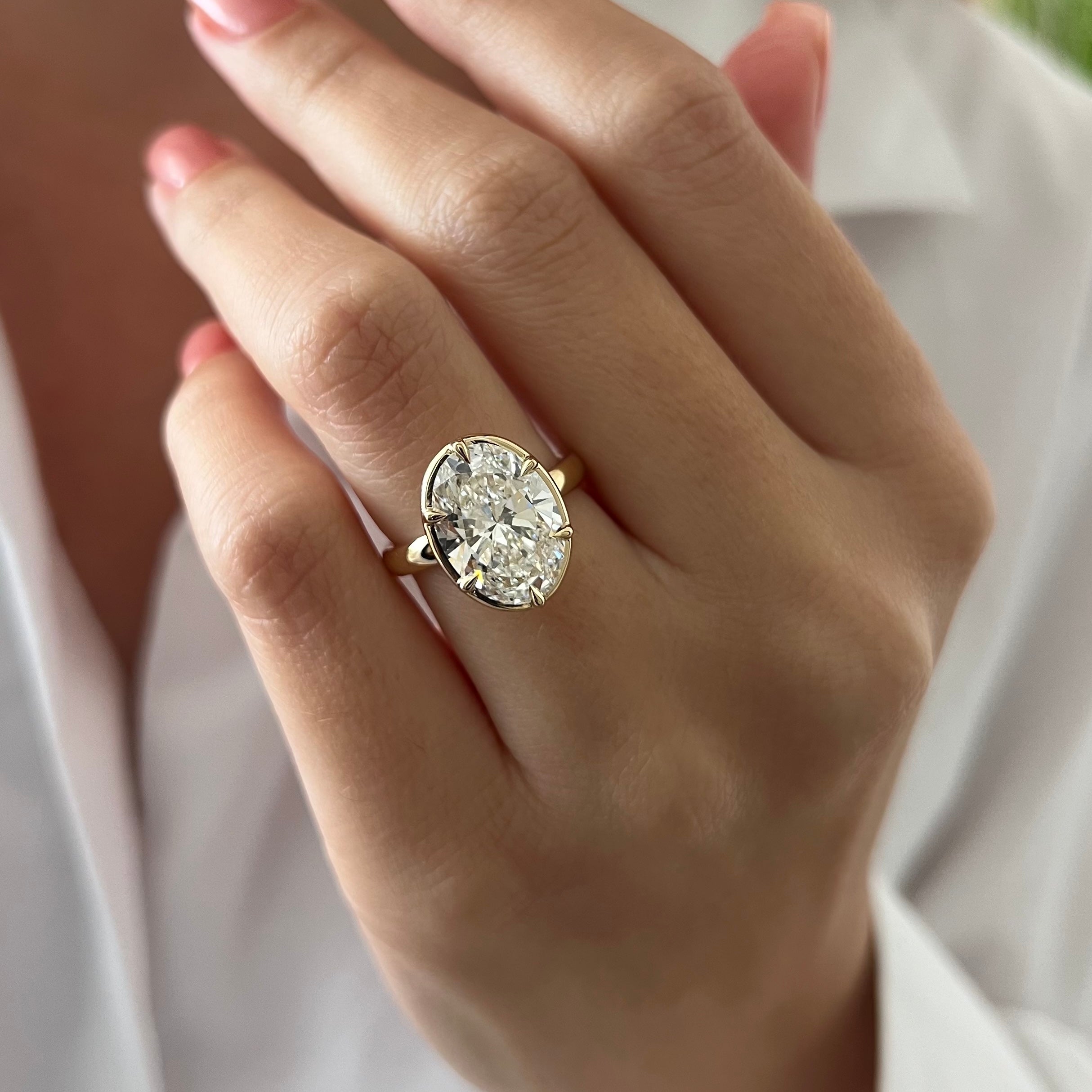 5 carat Oval cut lab-grown diamond IGI certified, bezel engagement ring.