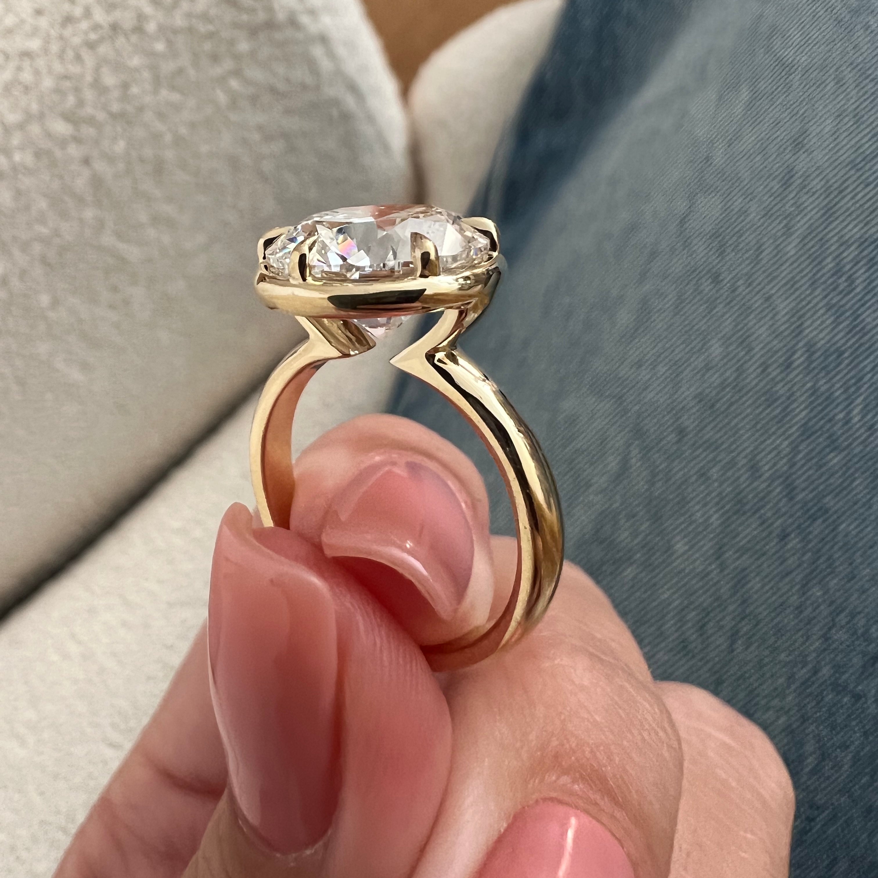 5 carat Oval cut lab-grown diamond IGI certified, bezel engagement ring.