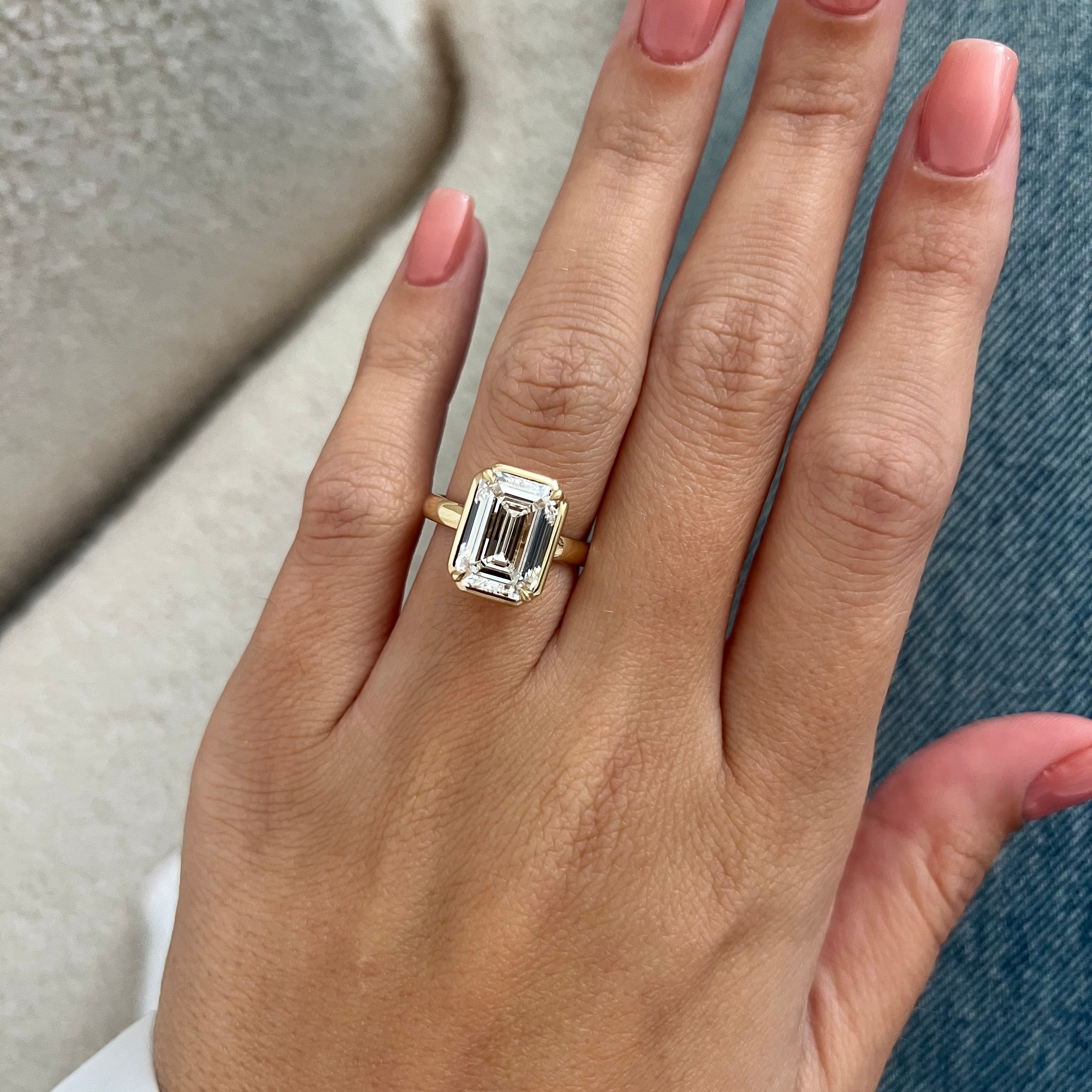 5 carat Oval cut lab-grown diamond IGI certified, bezel engagement ring.