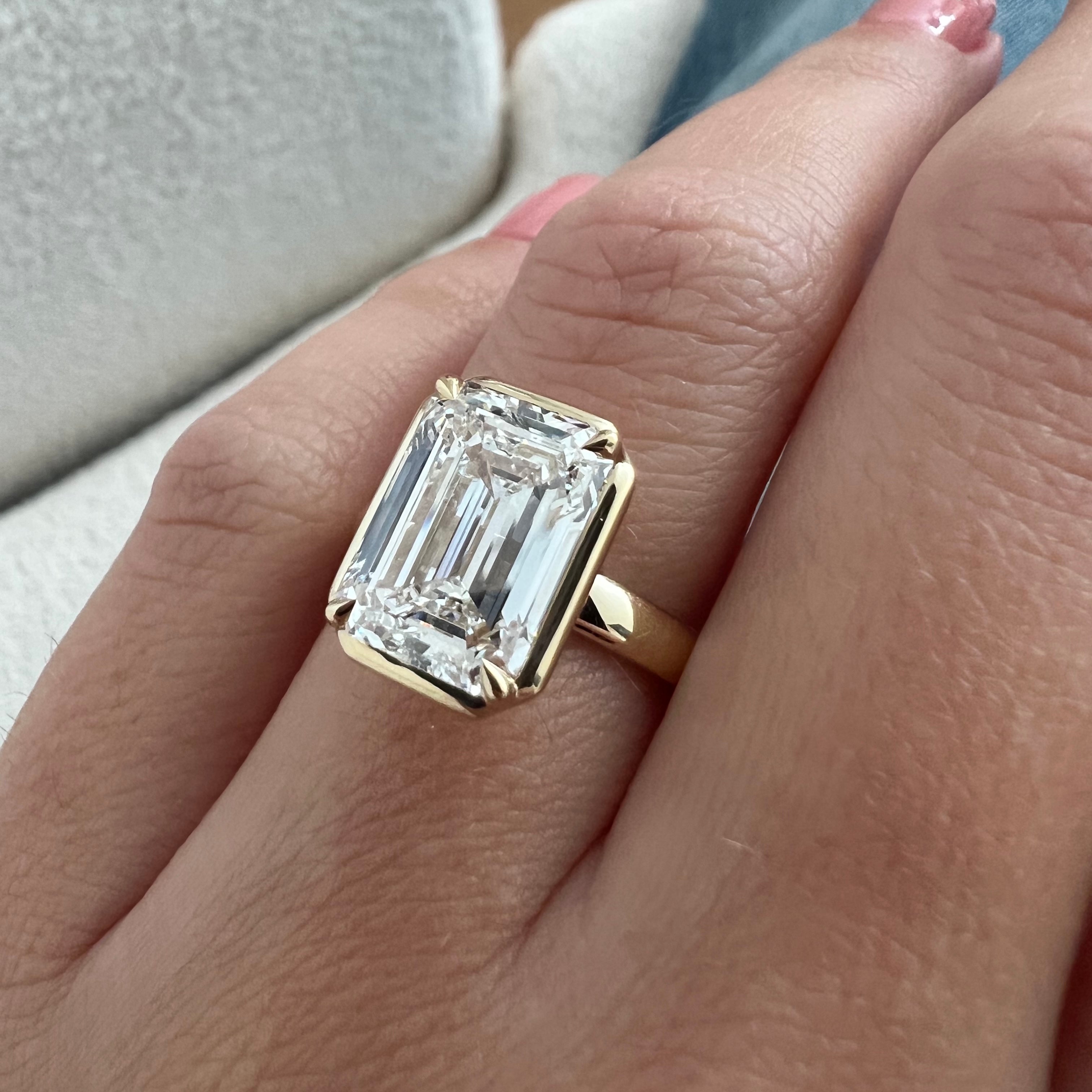 5 carat Oval cut lab-grown diamond IGI certified, bezel engagement ring.
