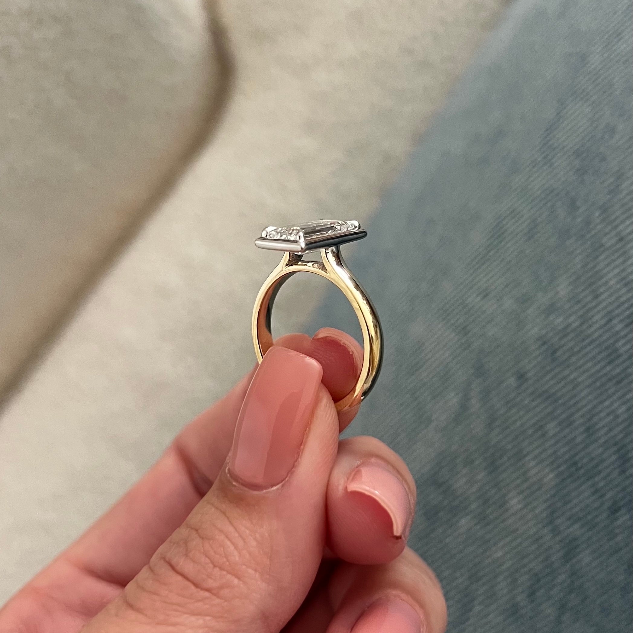 2 carat Oval cut lab-grown diamond IGI certified, bezel engagement ring.